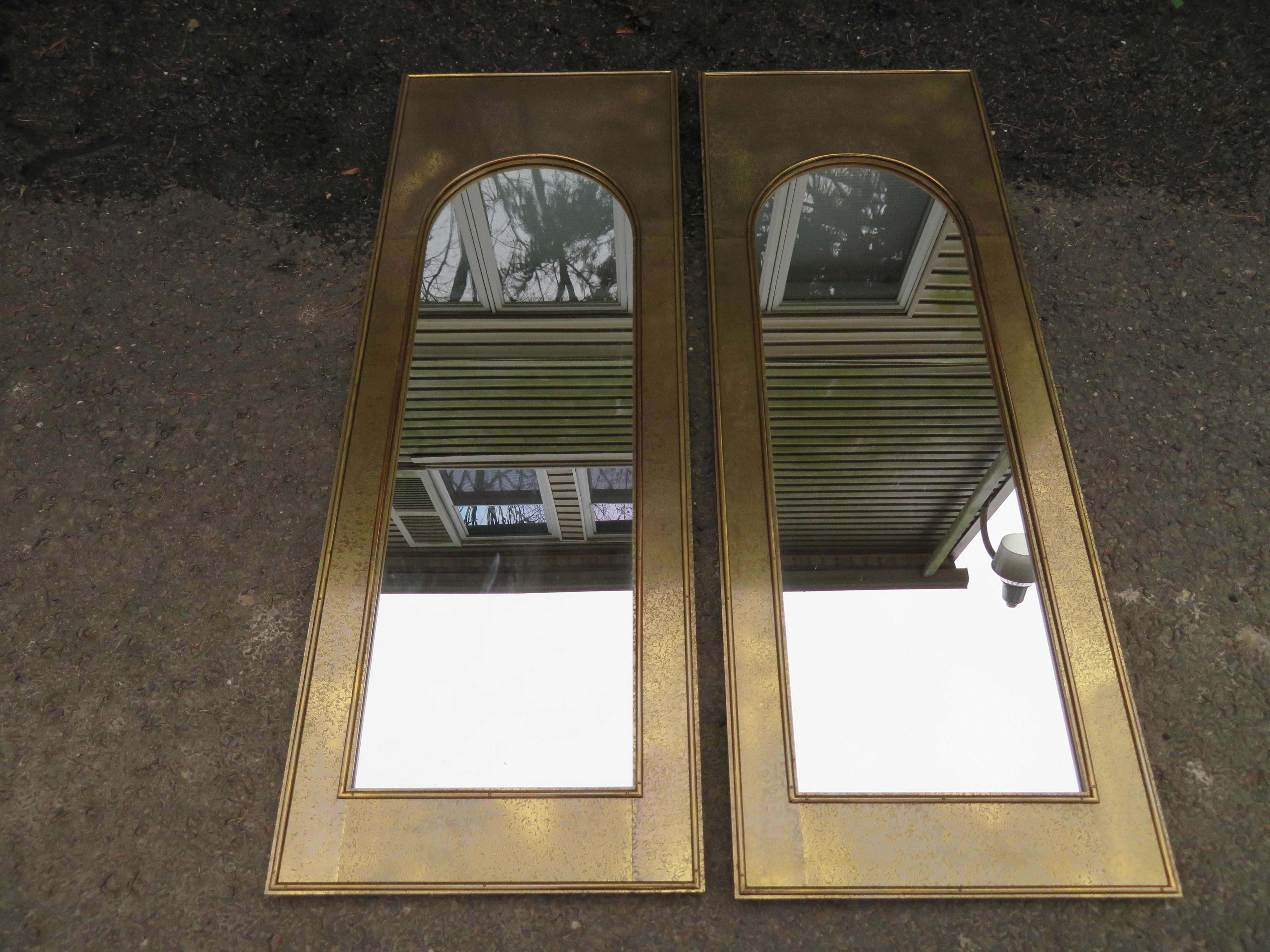 Magnificent pair of Mastercraft etched brass arched Palladian topped mirrors. These mirrors are in wonderful vintage condition and are very high quality made with old world craftsmanship. They measure 55