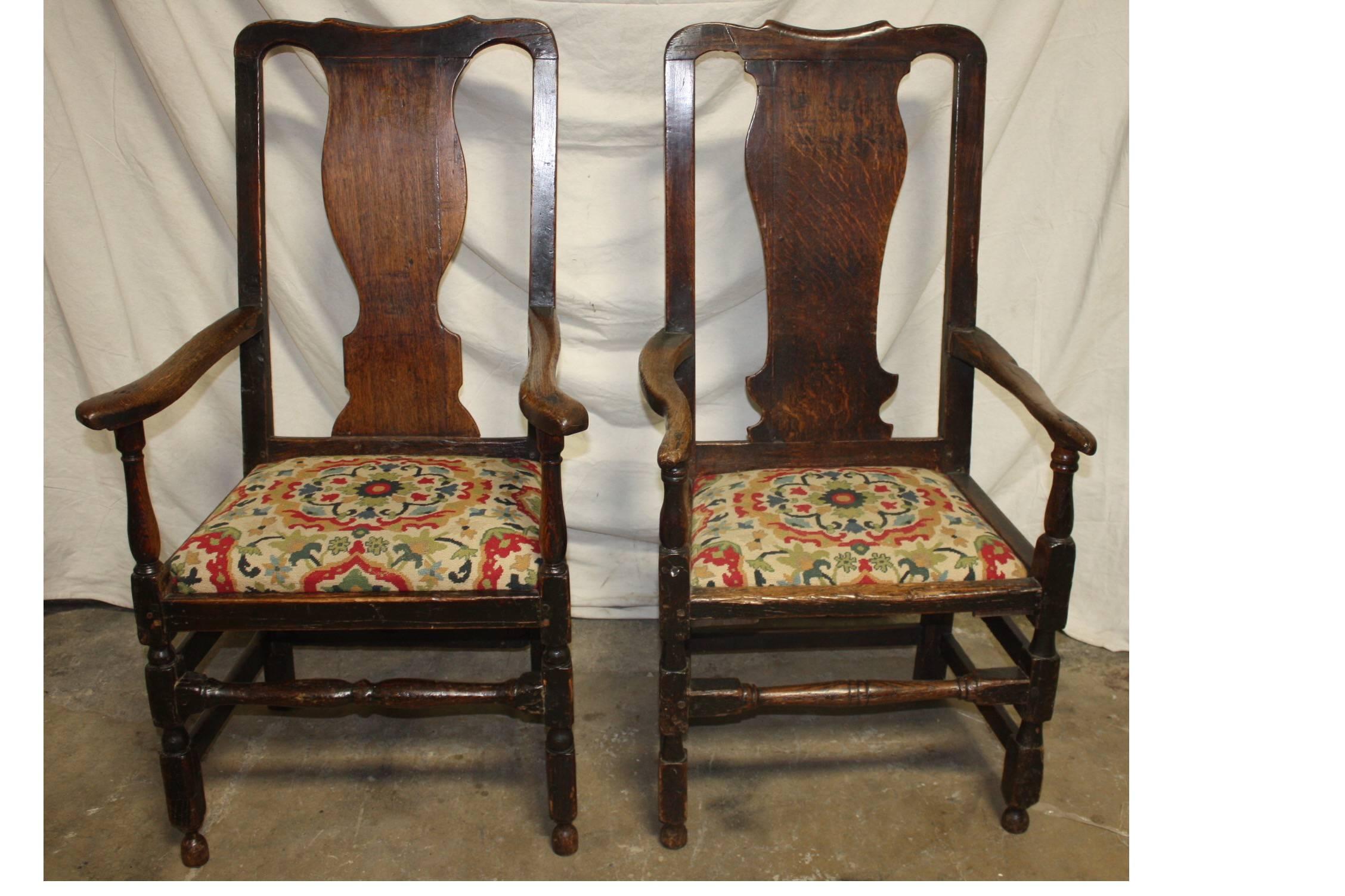 Magnificent pair of 17th century armchairs with a needle point seat cover.