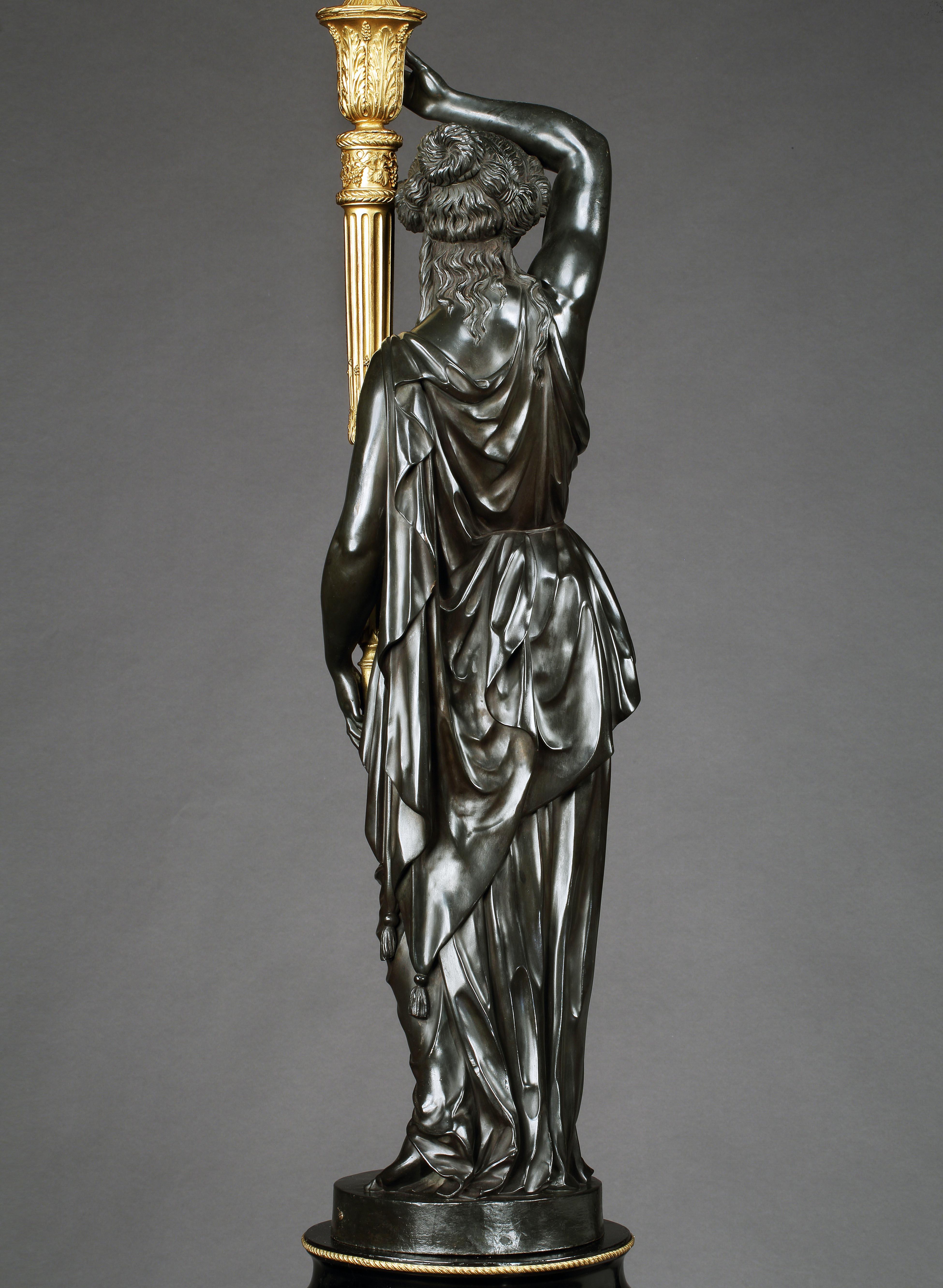 Patinated Magnificent Pair of 19th Century Bronze Figural Torchères by Henry Dasson For Sale