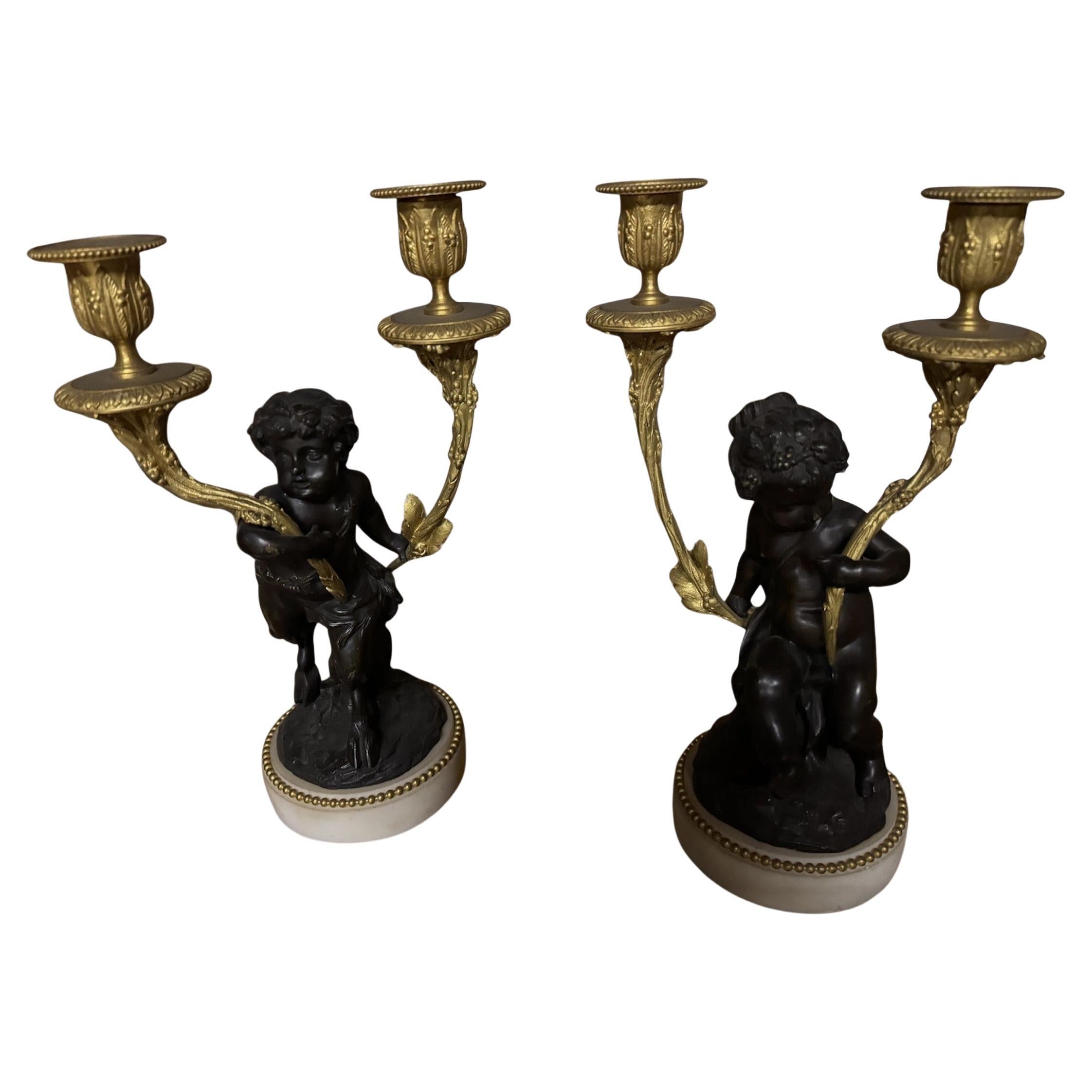 Magnificent pair of cherub candlestiks in bronze For Sale
