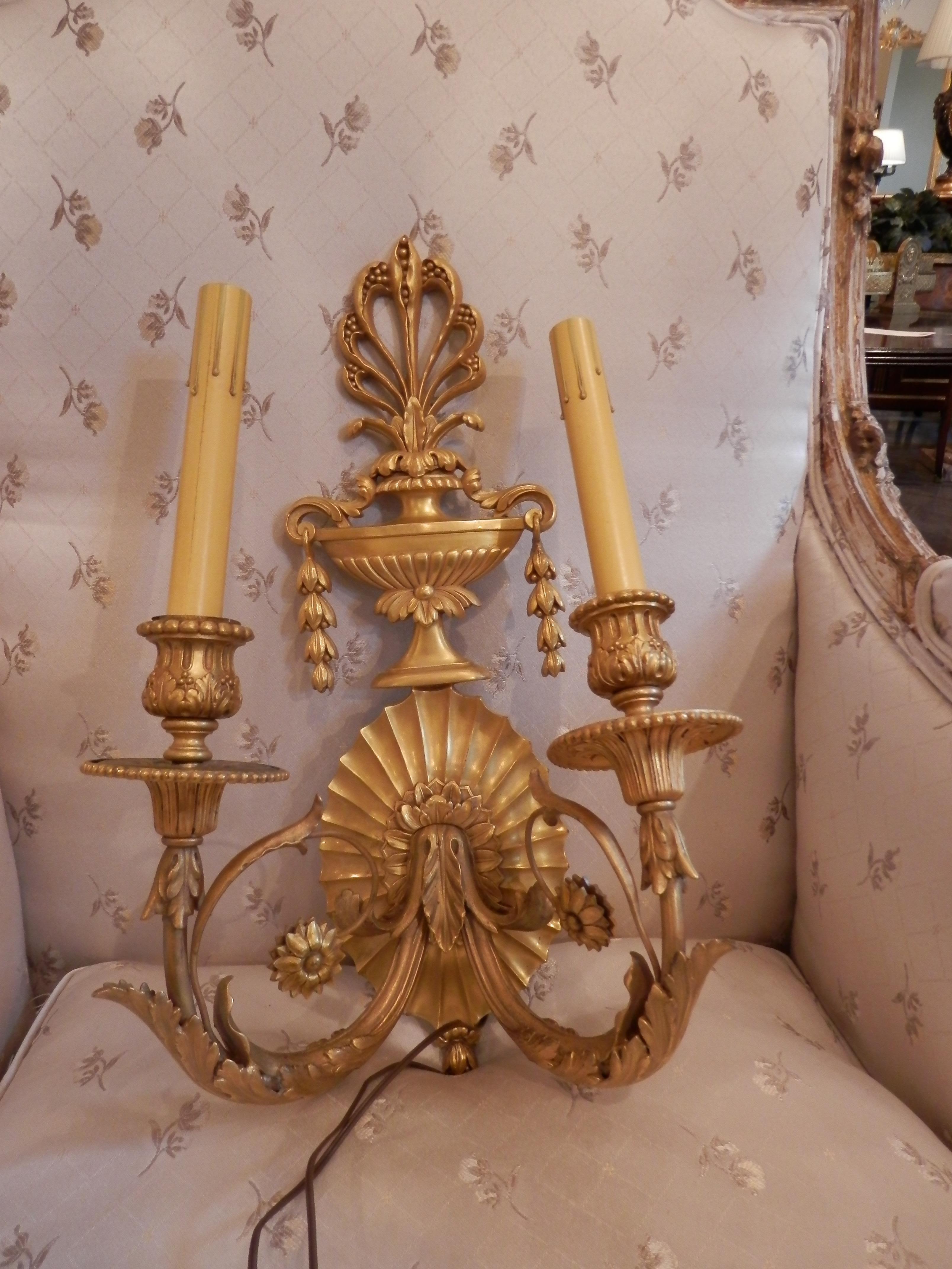 A fine pair of late 19th century French classical mercury gilt sconces signed Edward Caldwell New York.