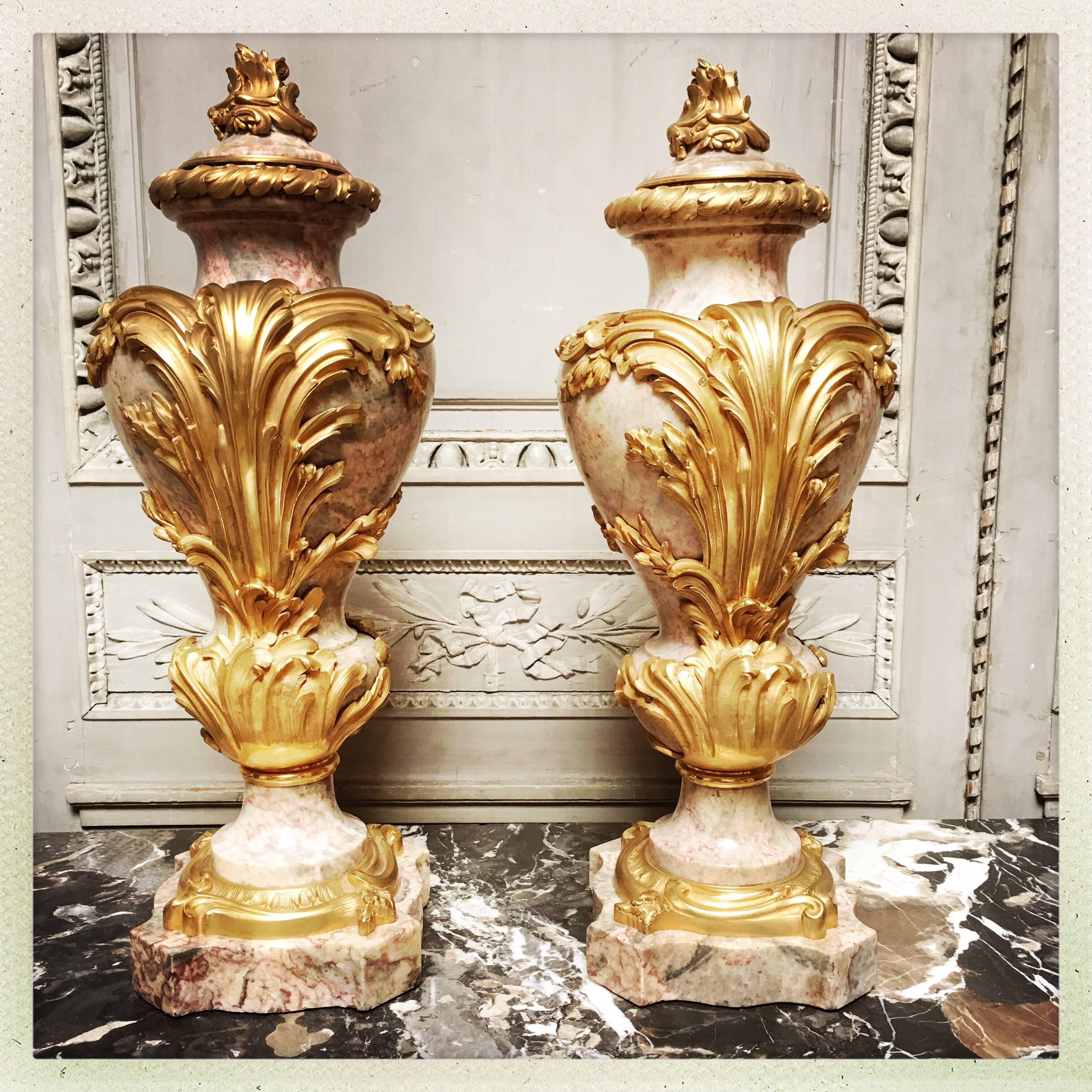 A very large pair of French marble and bronze cassolettes in the Rococo style.