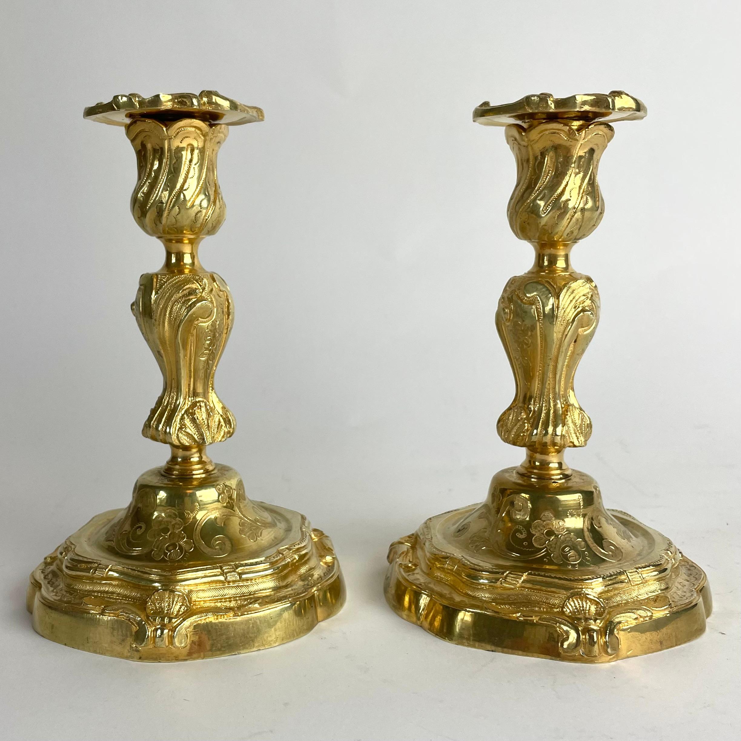 Magnificent Pair of Gilt Bronze Candlesticks in French Rococo (Louis XV), c. 1760–70

An exceptional pair of antique gilt bronze candlesticks, crafted in France during the second half of the 18th century. Executed in elegant French Rococo (Louis XV)