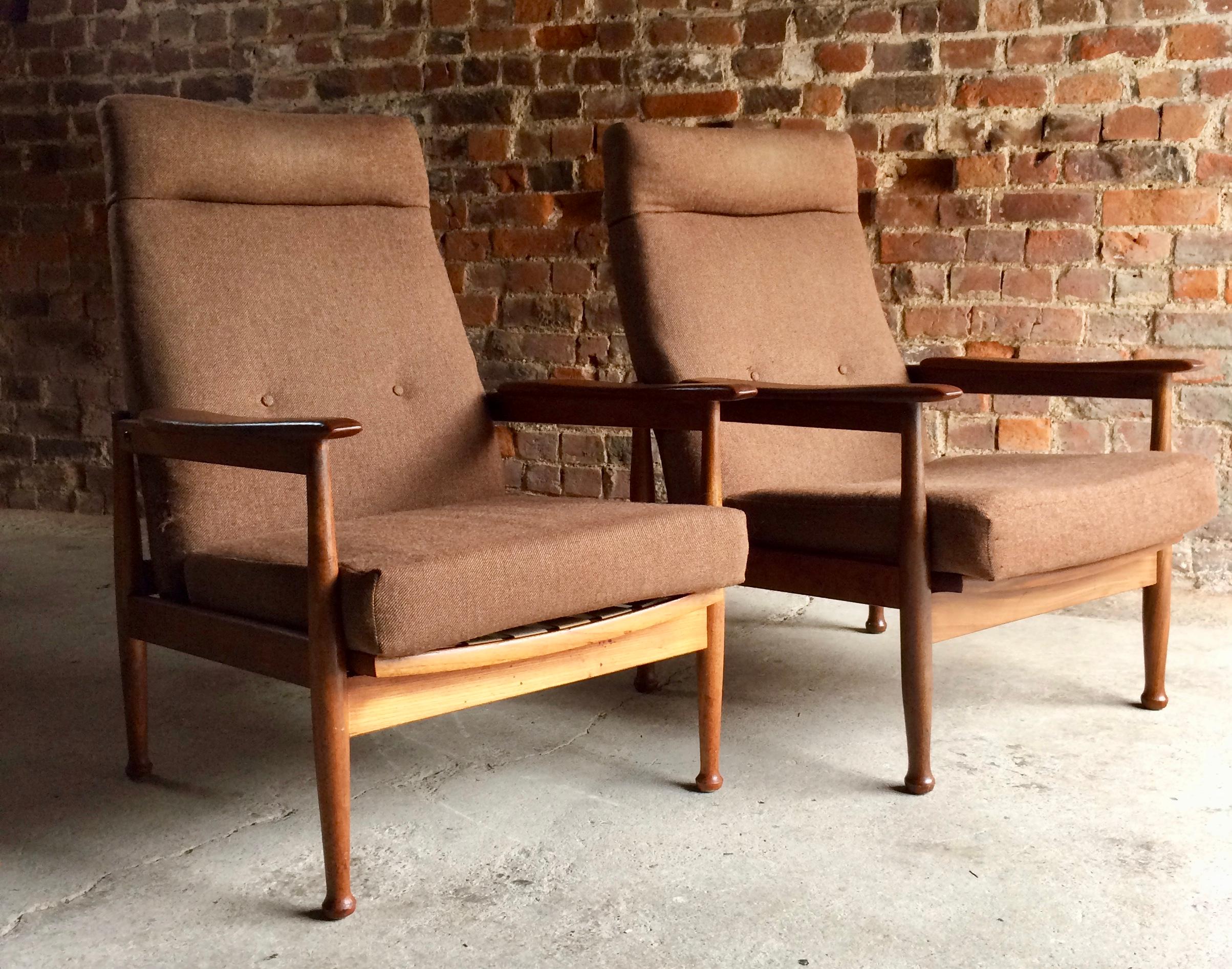 A pair of Guy Rogers Teak Recliner Armchairs, Manhattan Design.

?

?

1960s

Teek

Guy Rogers

Reclining Seat

Pair

Practical & Beautiful 

?

Dimensions per chair:

?

Height: 37” Inches/94cm (Floor to seat 16”