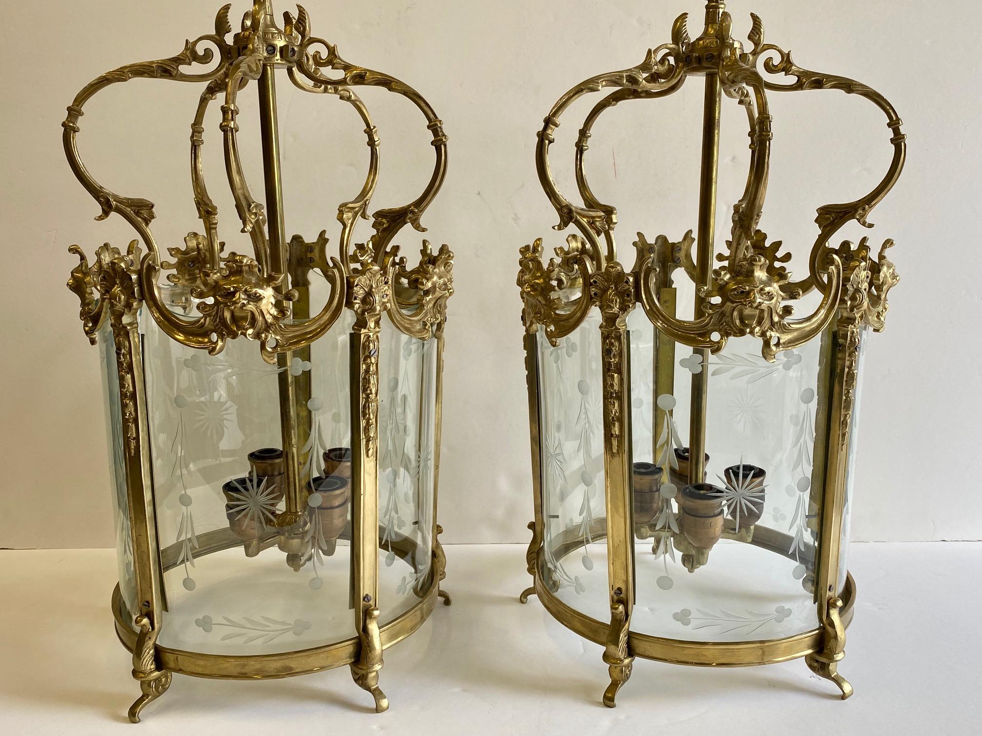 Fancy pair of solid cast brass Italian lanterns having etched glass and four sockets in each.