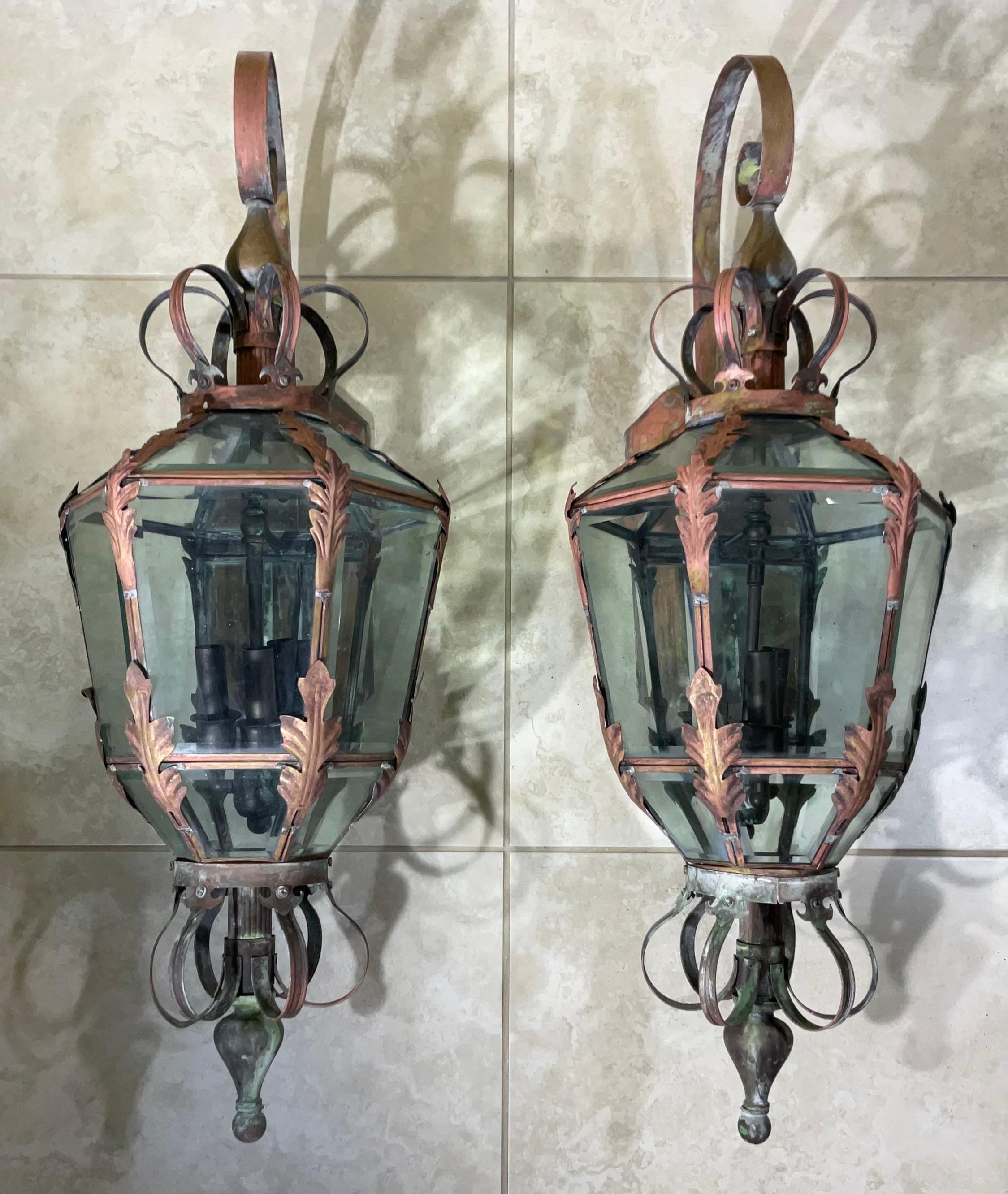 

Elevate the grandeur of your home with this stunning pair of vintage brass lanterns. These architectural masterpieces are a testament to exquisite vintage craftsmanship and timeless design.
Each lantern has three 40/watt lights , all around with