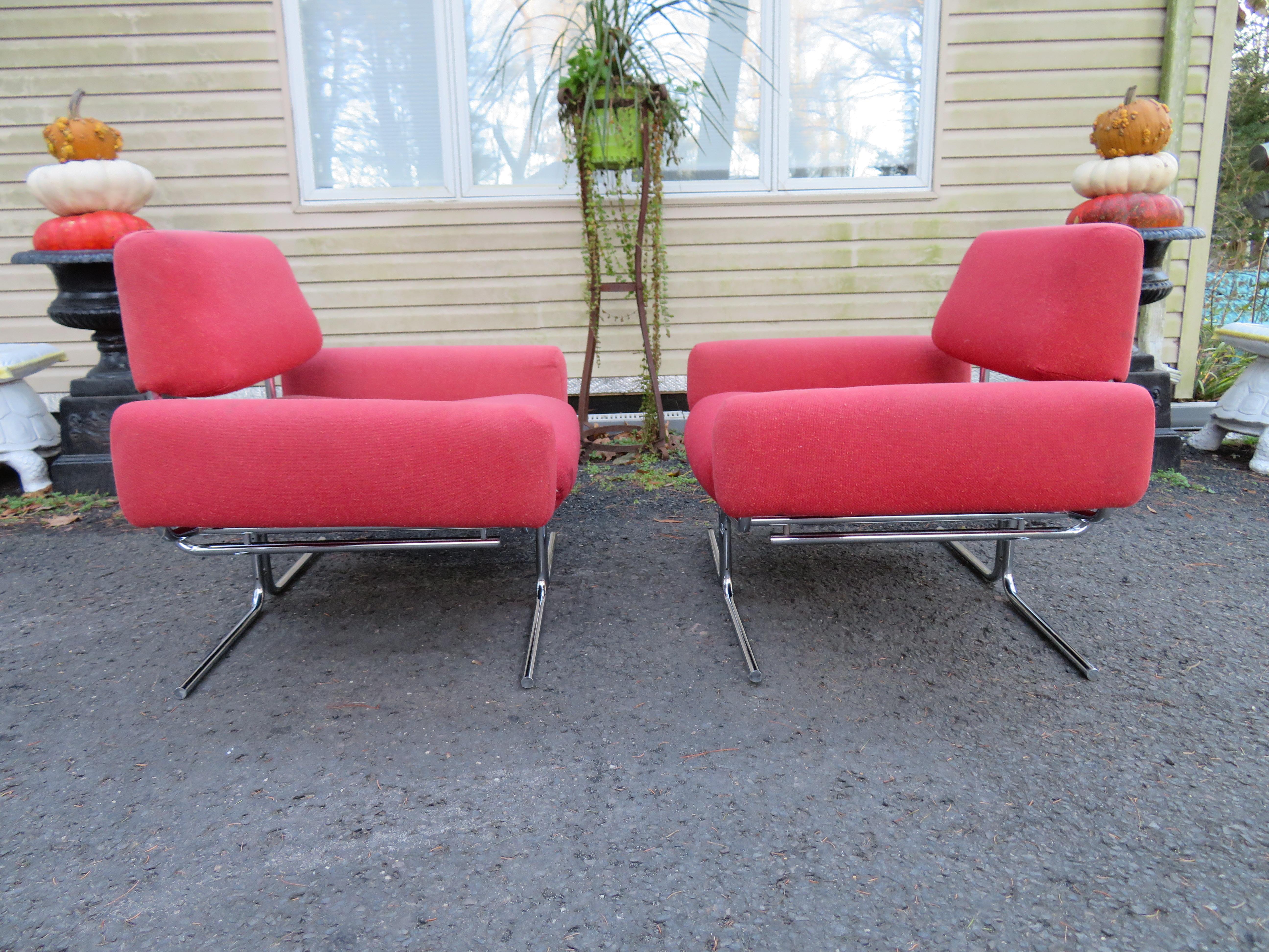 Magnificent pair of Space Age chrome tubular lounge chairs in the style of Ingmar Relling. These chairs are a bit of a mystery as to designer but by the shear quality and craftsmanship they shout that the designer is someone important. These were