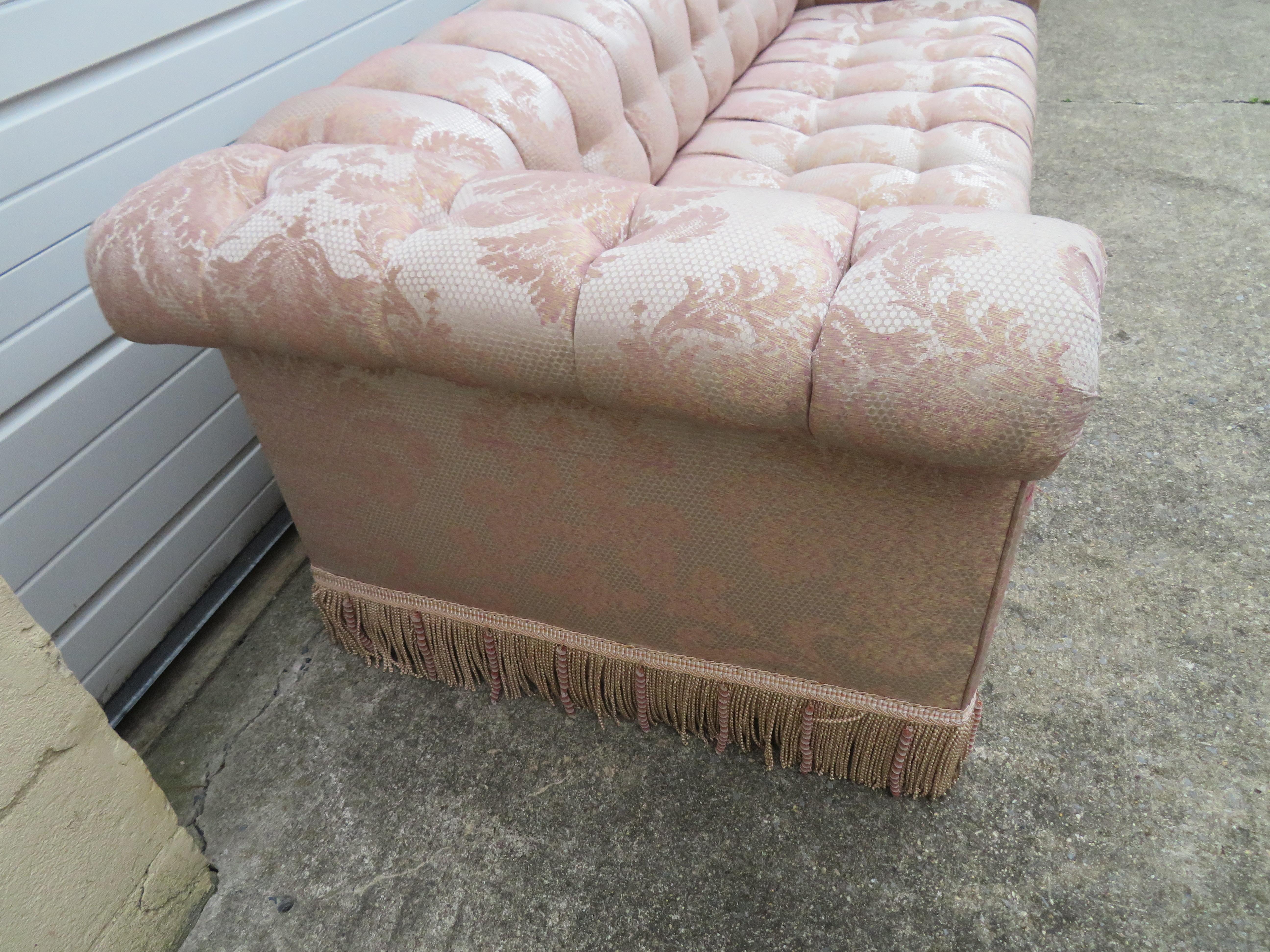 Magnificent Milo Baughman style Directional biscuit tufted party sofa. This sofa was re-upholstered about 15 years ago and would be best-redone again-few pulls to the front of the arms. This piece measure 27