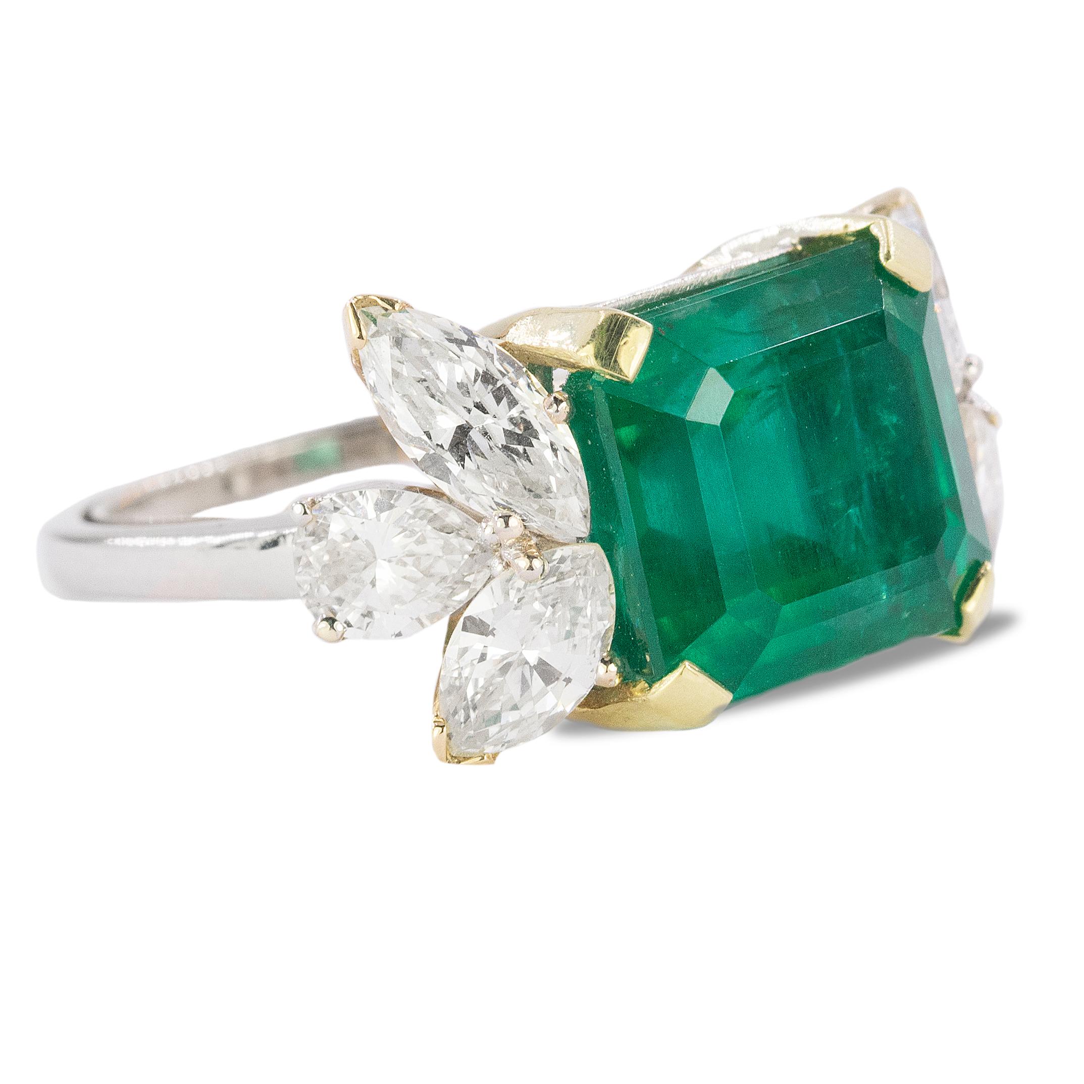 Platinum & 18k ring with AGL certified 7.81 carat emerald and 4 marquius and 2 pear shape diamonds weighing 1.83 carats. 