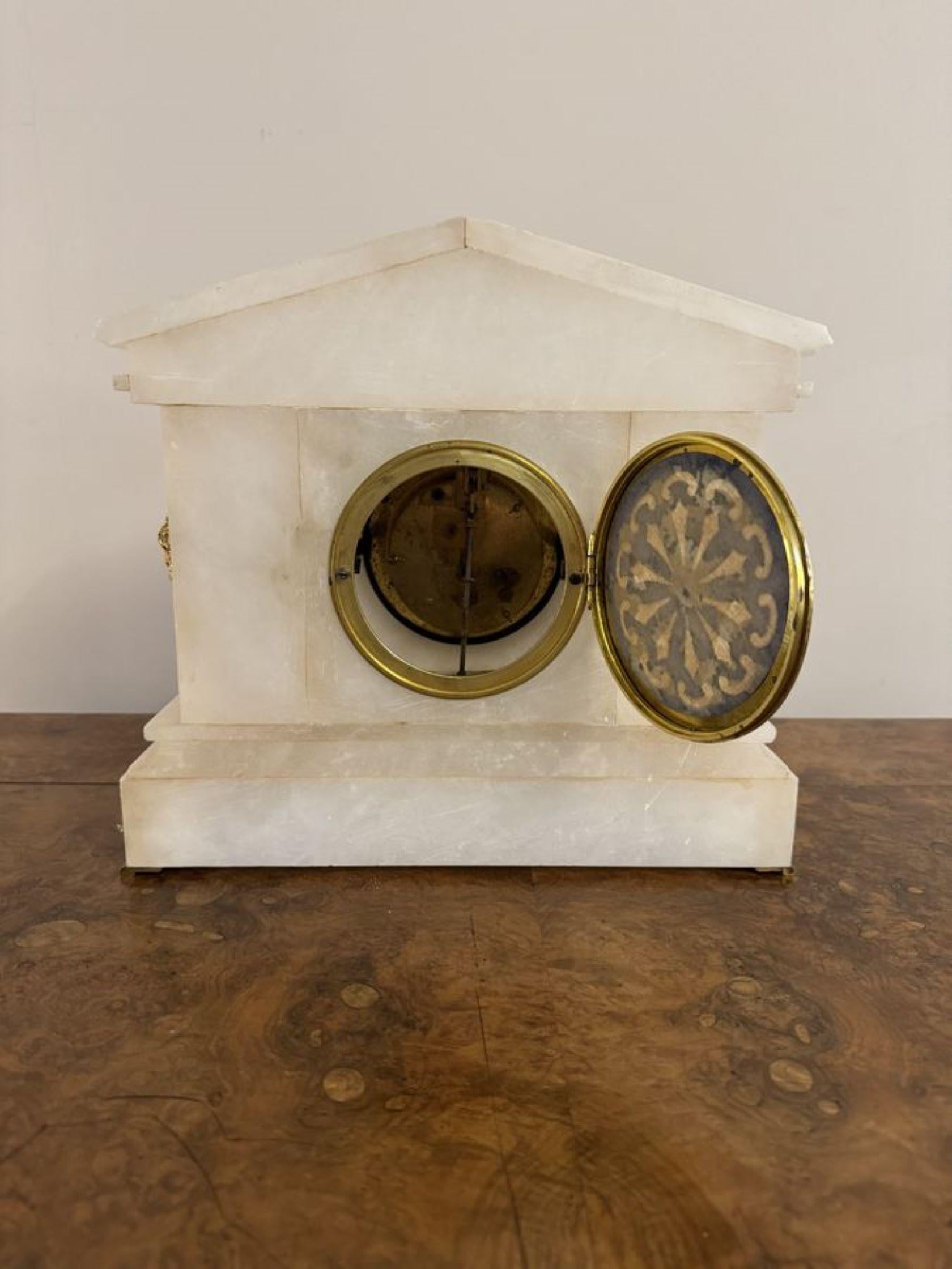 Magnificent quality antique Victorian alabaster mantel clock, having a quality antique Victorian alabaster mantle clock of architectural form, with gilded metal mounts and pillars, having a enamelled chapter ring with Arabic numerals and the