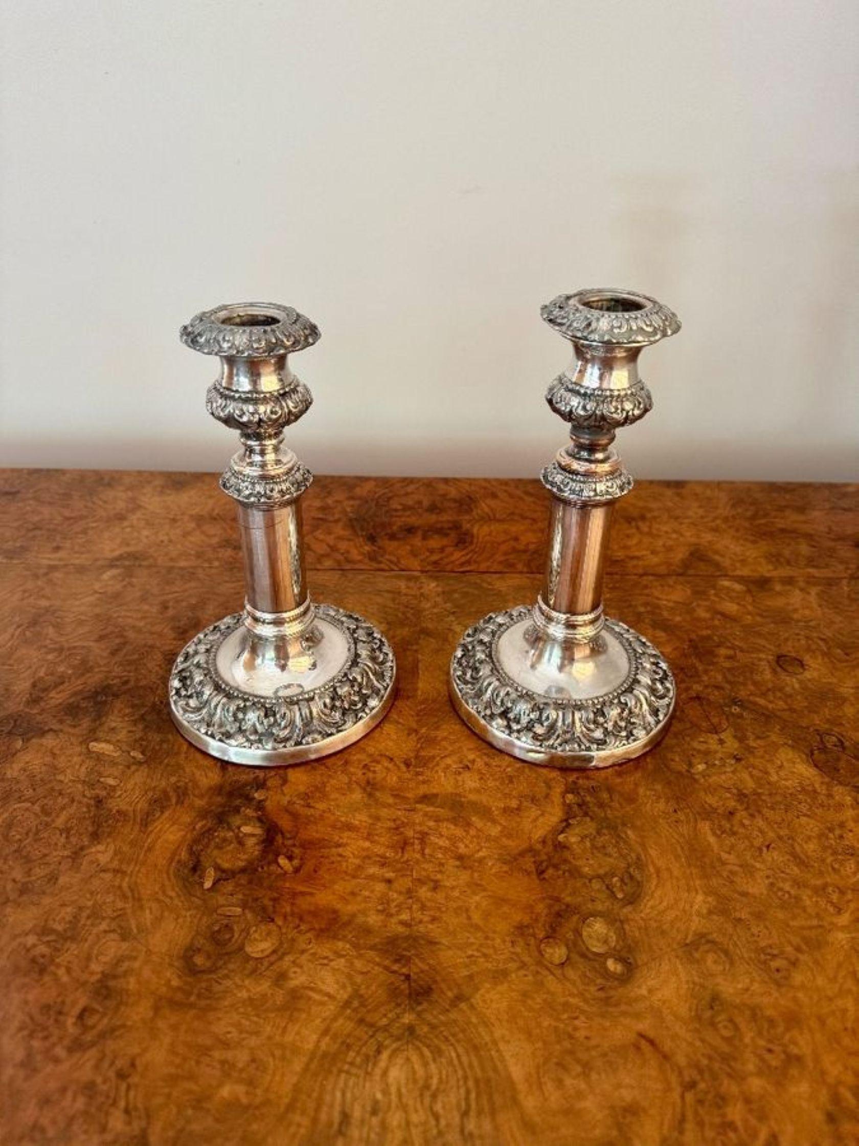 Magnificent quality pair of antique Georgian telescopic candlesticks, having a magnificent quality pair of antique Georgian silver plated telescopic candlesticks, having a slender stem flanked by ornate bulbous sections decorated with embossed