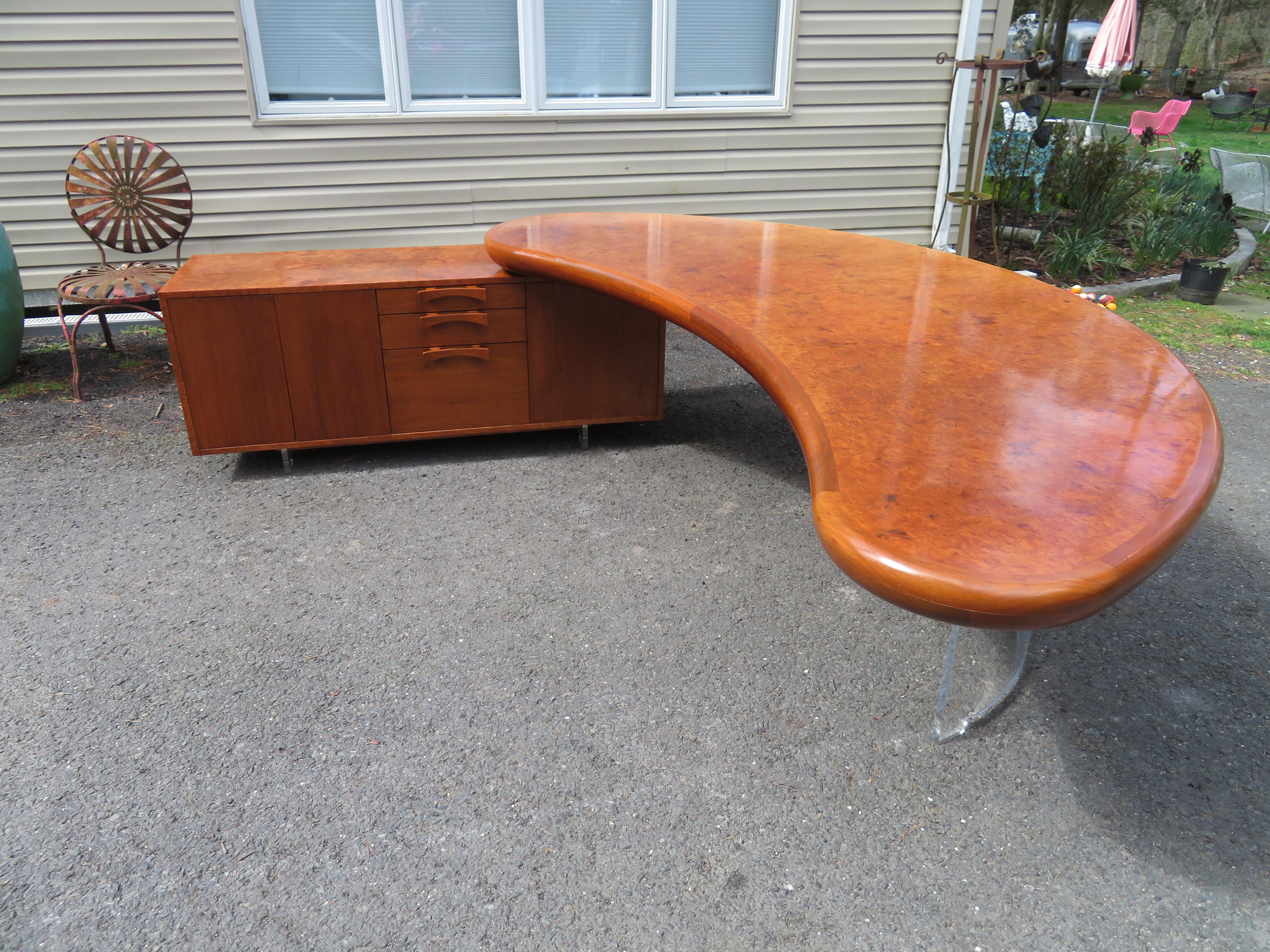 Magnificent Vladimir Kagan Burl and Lucite kidney shaped desk credenza. Very few of these unusual desk/ credenzas were ever made and all were custom made for private collectors. This one is stunning from all angles and will be the centrepiece of