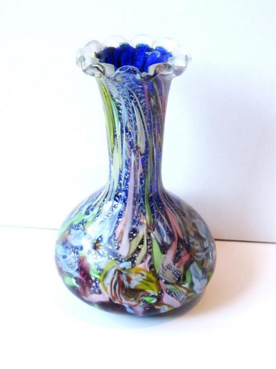 The Following Items we are offering is this Rare Important Italian Millefiori Large Multi Colored Flared Rim Glass Vase attributed to Fratelli Toso. Fantastic Detail with a Magnificent Array of Beautiful Colors overlaid on a Cobalt Blue Vase.