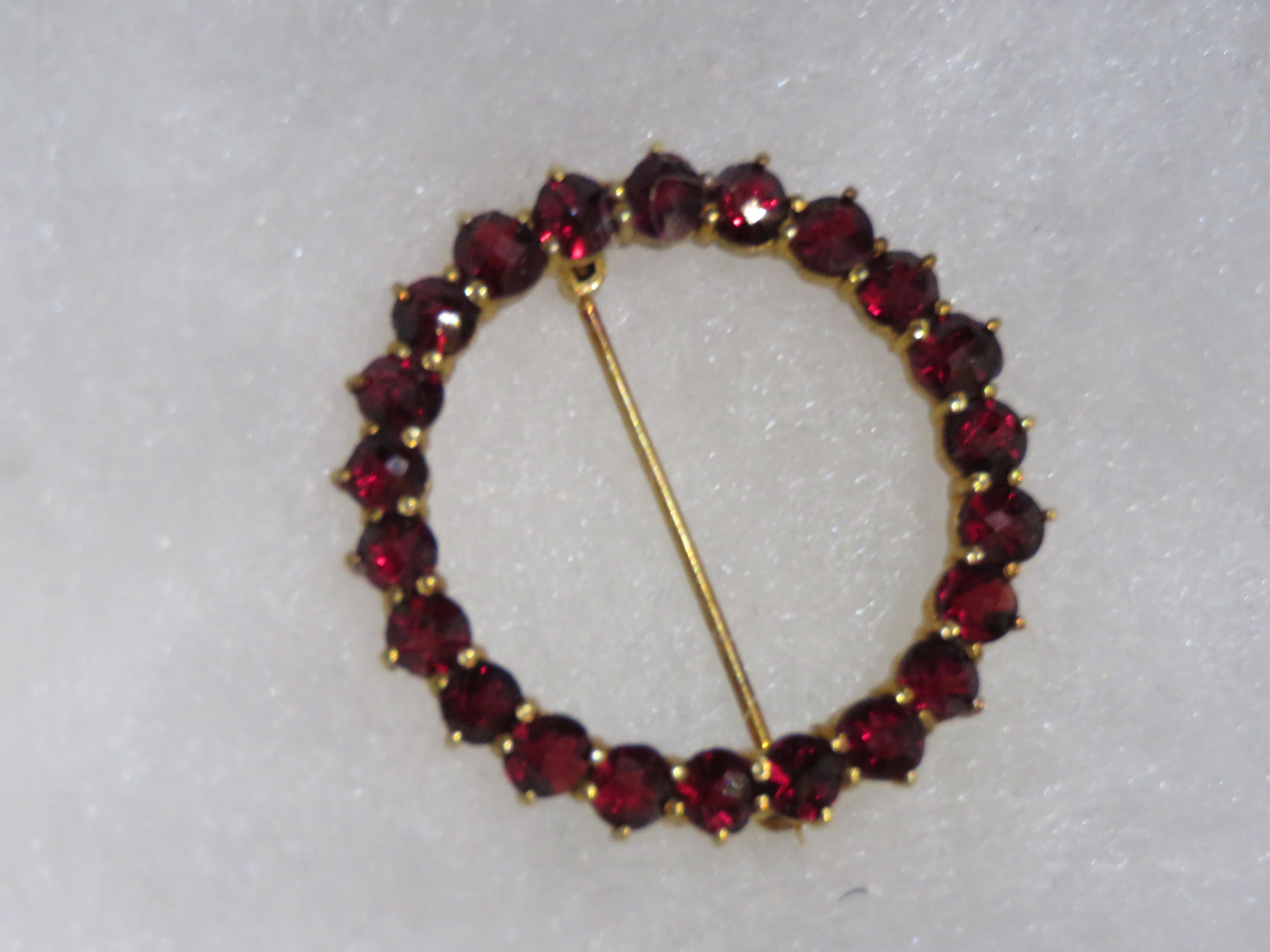 The Following Item we are offering is a Rare Important Radiant 14KT Gold Red Garnet Circular Brooch Pin. This Rare Piece Magnificent Rare Round Cut Glittering Garnets. Stones are Very Clean and Extremely Fine! T.C.W. approx 5CTS and measures approx