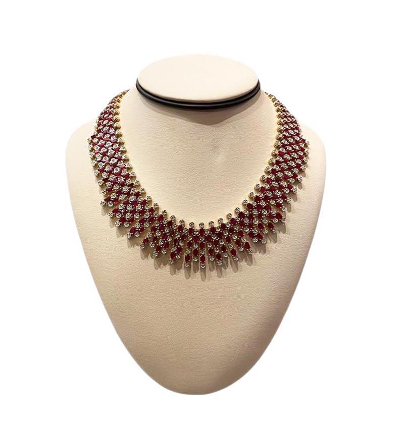 Style: Ruby and Diamond Necklace

Metal: Yellow Gold

Metal Purity: 14k 

Stones: 152 Oval Cut Rubies  totalling approx 22 cts

​​​​​​​             320 Round Brilliant Cut Diamonds totalling approx 3 cts

Total Weight: 155.6 g

Diamond Color: