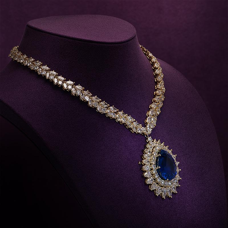 Simply Beautiful! Finely detailed Magnificent Mid Century Modern Sapphire and Diamond Gold Brooch Pendant Necklace. Center of Pendant, securely Hand set with a Blue Sapphire, weighing approx. 66.29 Carats. Measuring 26.20mm x 21.40mm x 14.30mm and