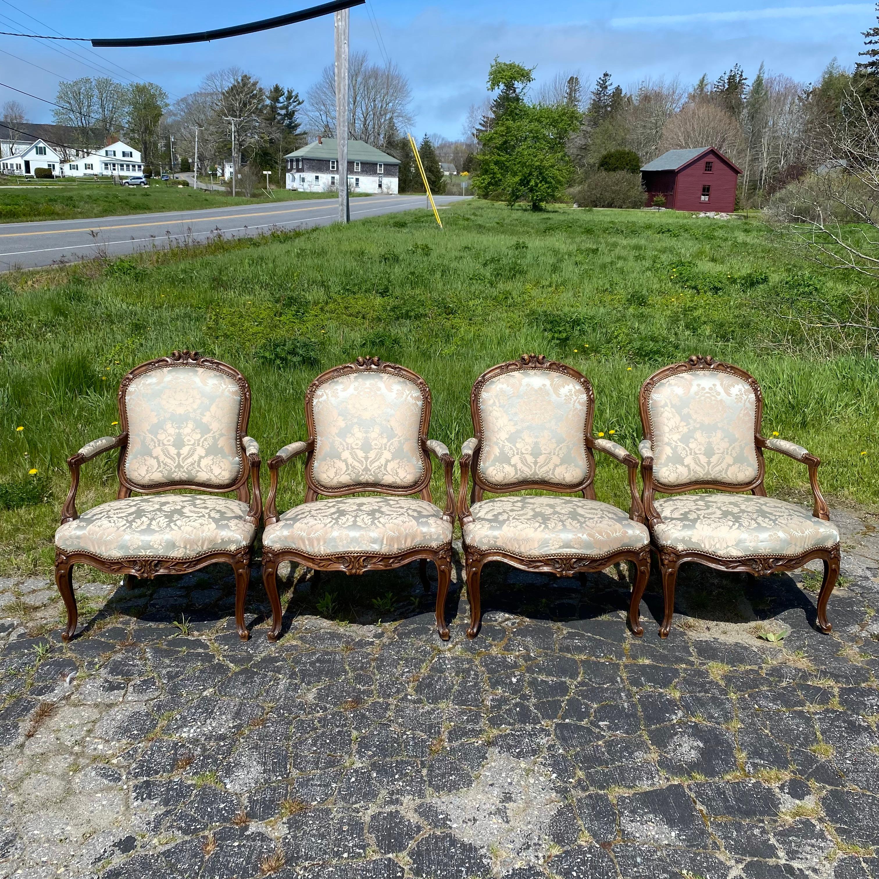 Really beautiful set of Four French Louis XV Highly Carved Fauteuils or Armchairs bough in the South of France and in immaculate shape. Intricately carved pen armchairs, upholstered in a lovely subtle damask. Displaying cartouche shaped backs,