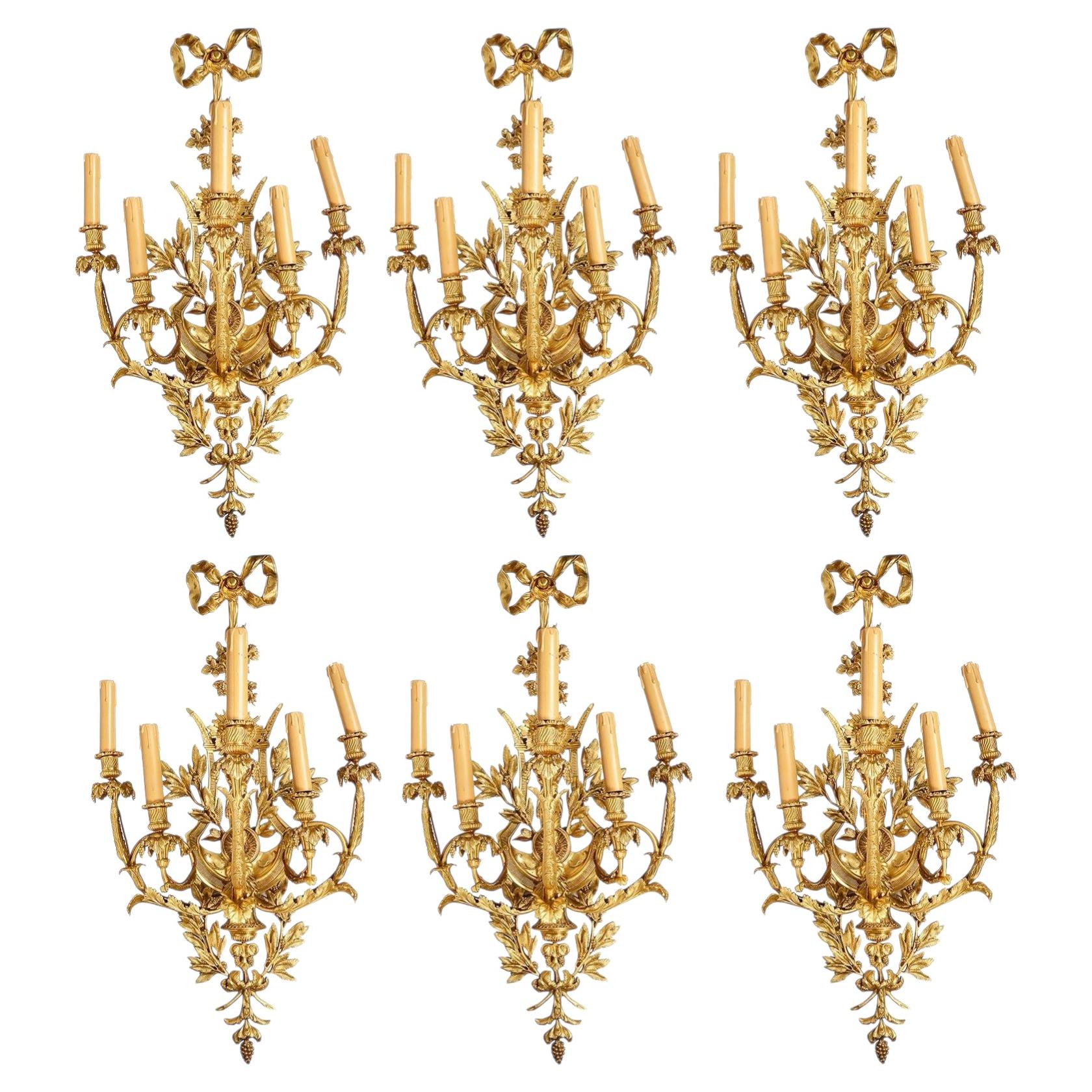 Magnificent set of six Louis XVI style gilded ormolu wall sconces.