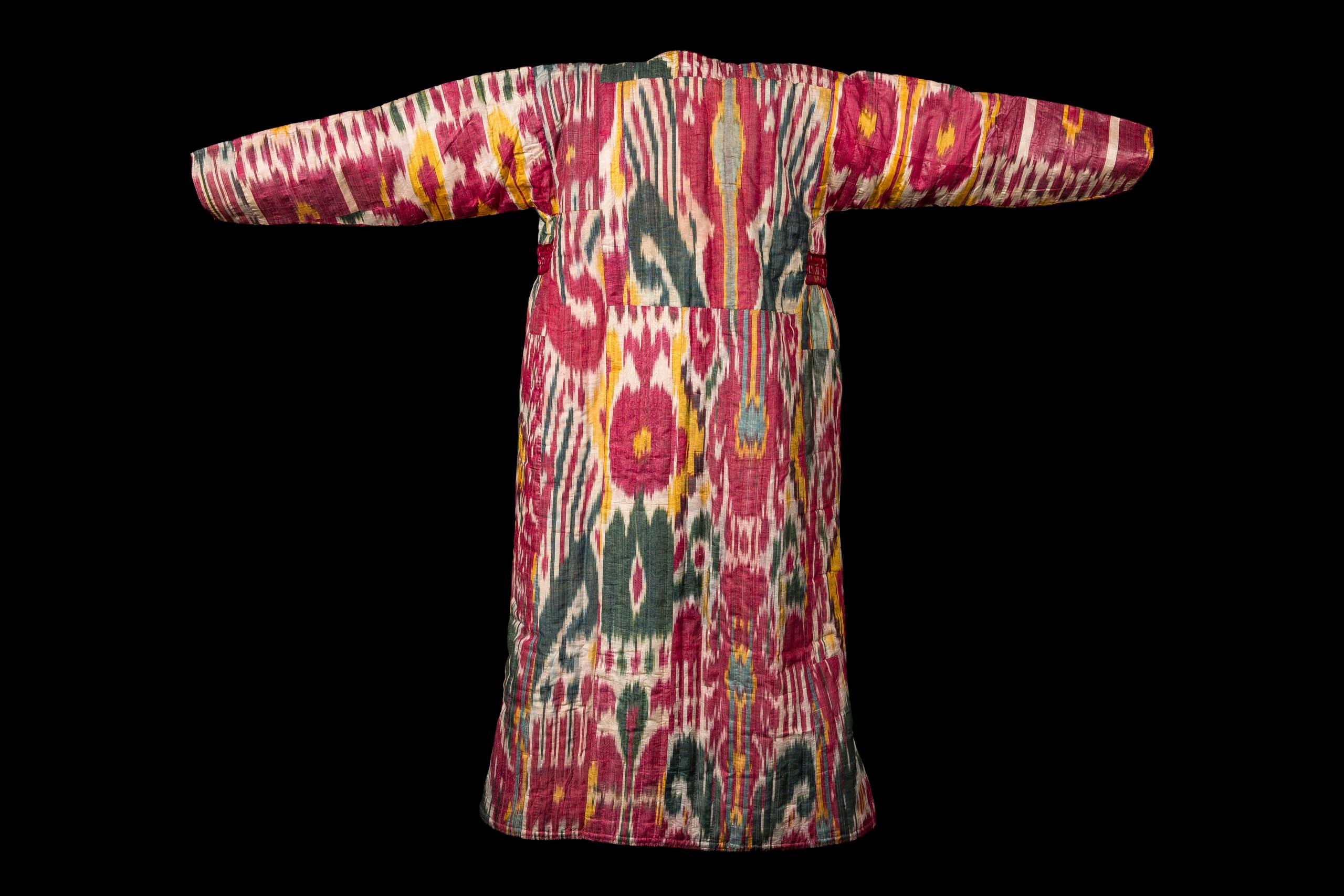 Ikat Chapan – a man’s uzbek coat – Style Robe with exceptionally rich colour and dynamic pattering. Viewers may become lost in this ikat’s intertwining motifs, but it is colour that truly entrances them. Each unique ikat is the work of an individual