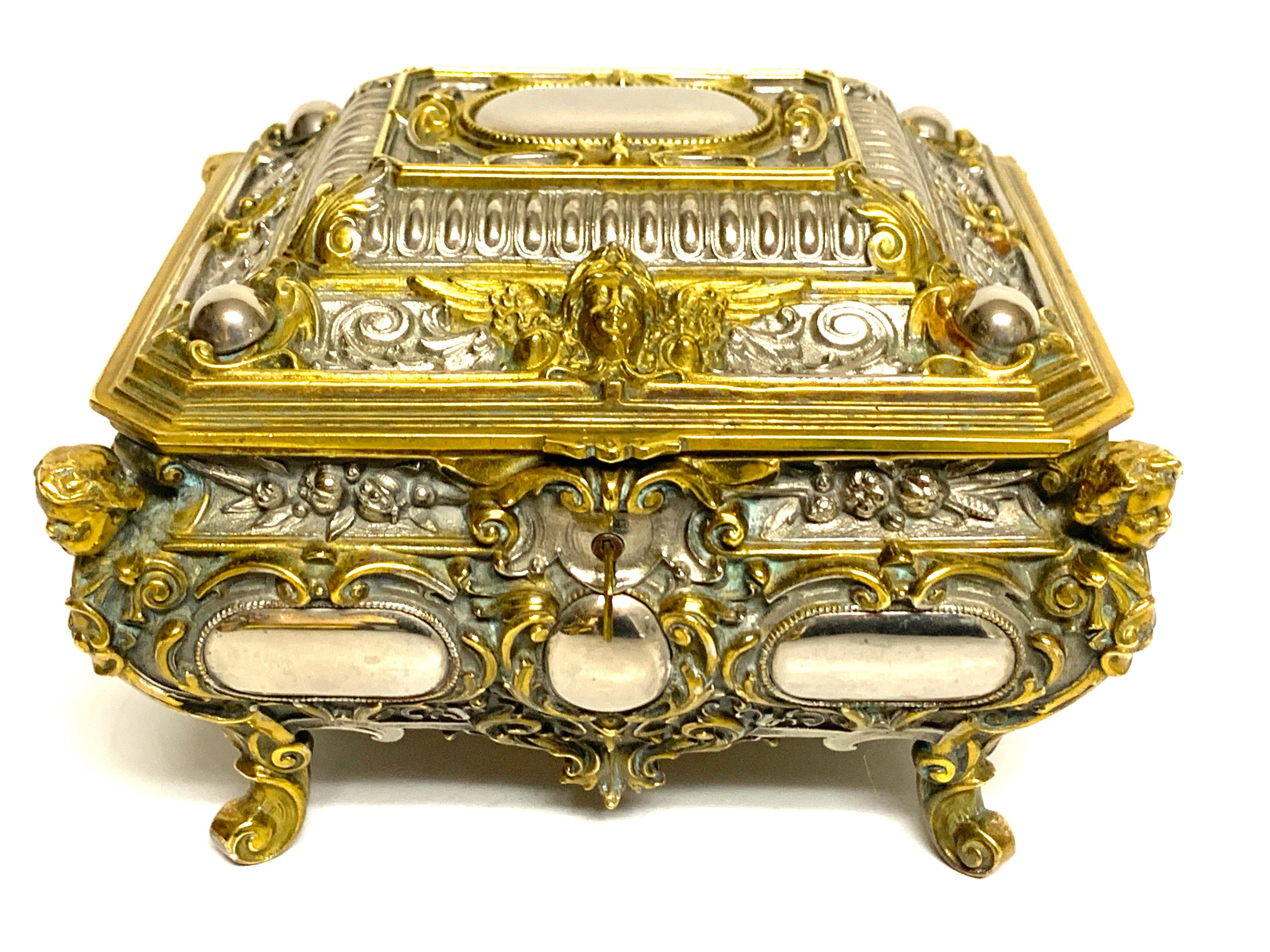 Magnificent silvered bronze and ormolu jewelry/table box, a substantial heavy weight box with Intricate detail with the silvered bronze resembling mirrors, with ormolu mounts. Complete with a very secure lock with two working keys. The interior