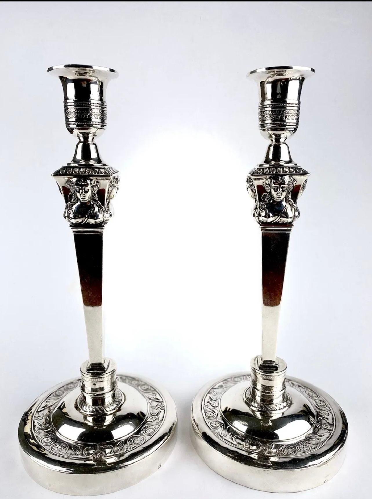 A Magnificent Solid Silver Pair of Georgian Candlesticks.

PLEASE NOTE: These are not weighted to base, the weight is in Sterling Silver.

Dating from the first years when France became a Republic.

The Pair are decorated on all sides by a Maiden