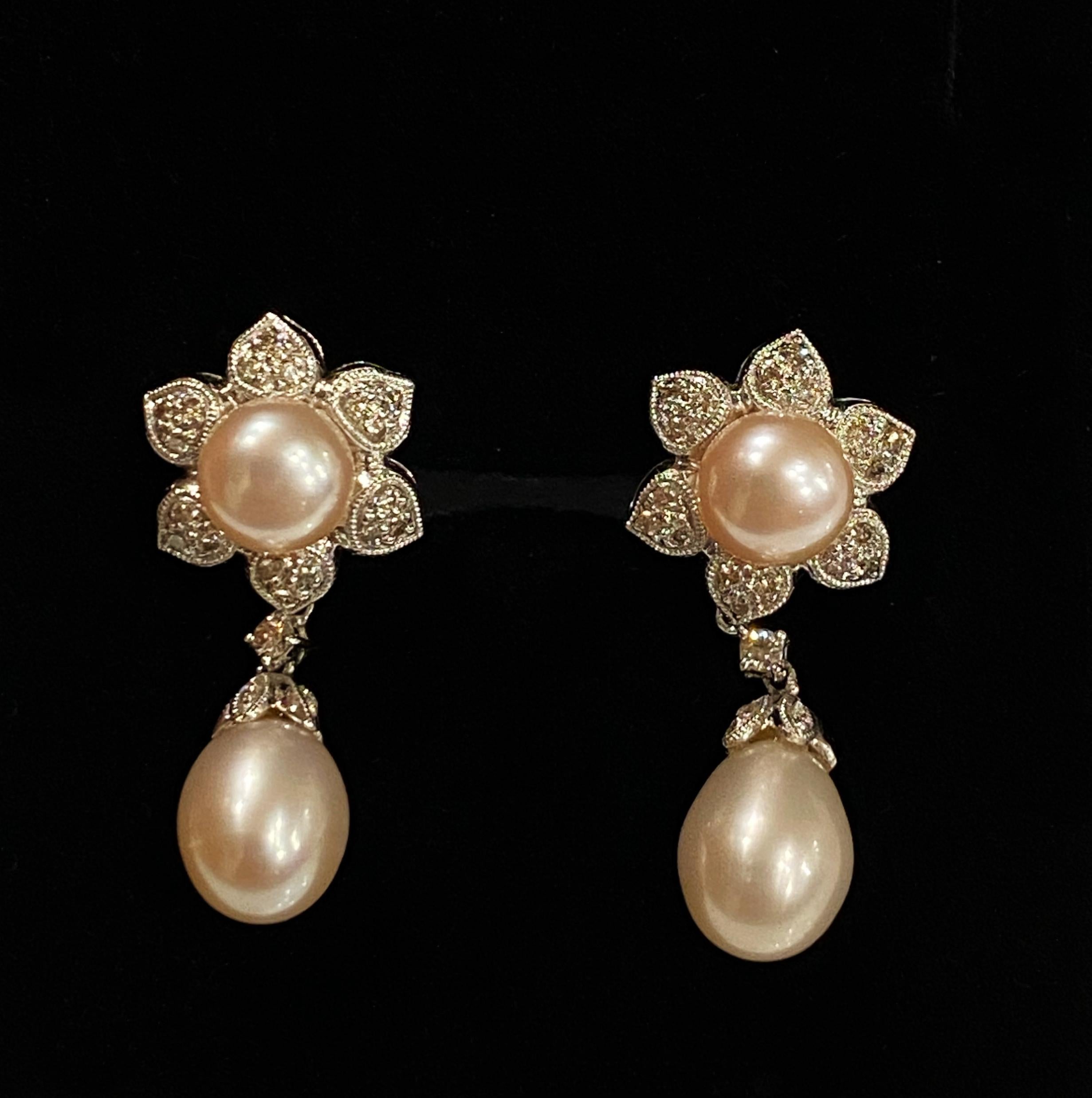This magnificent pair of South Sea Pearl & 
Diamond Dangle (Pendant) Earrings 
feature a drop design, that is both very feminine & elegant and
secure & comfortable posts & omega backings

Meticulously crafted in 18K White Gold, 
each earring