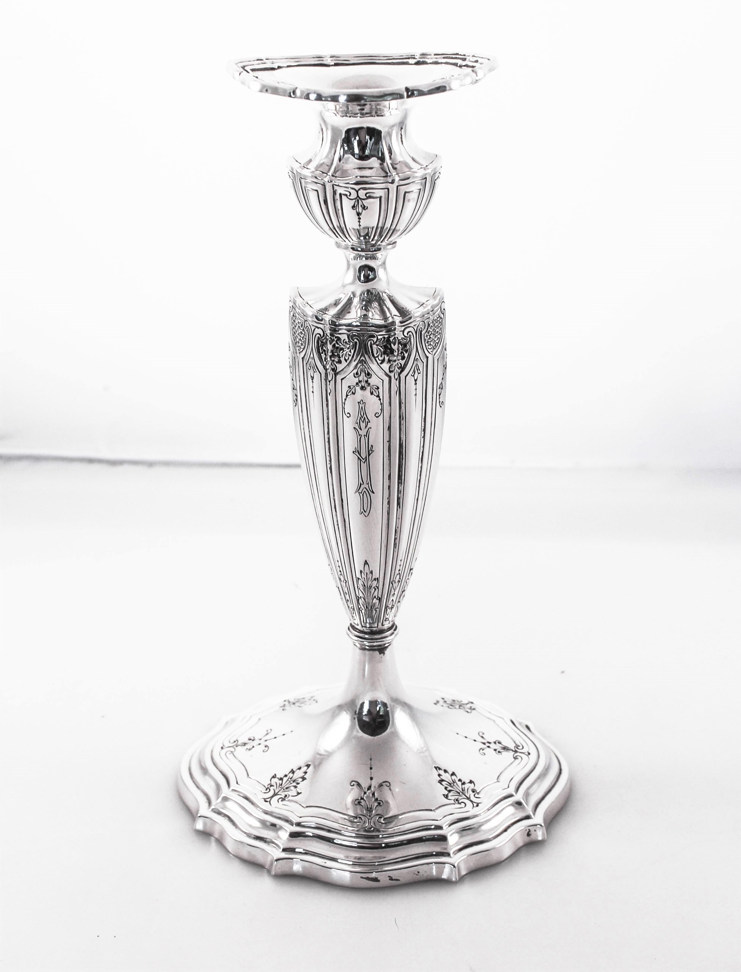We are so proud to offer this pair of sterling silver candlesticks by William Durgin of Concord, New Hampshire. Known for their exceptional sterling patterns and designs, these candlesticks are living proof that almost one hundred years later Durgin