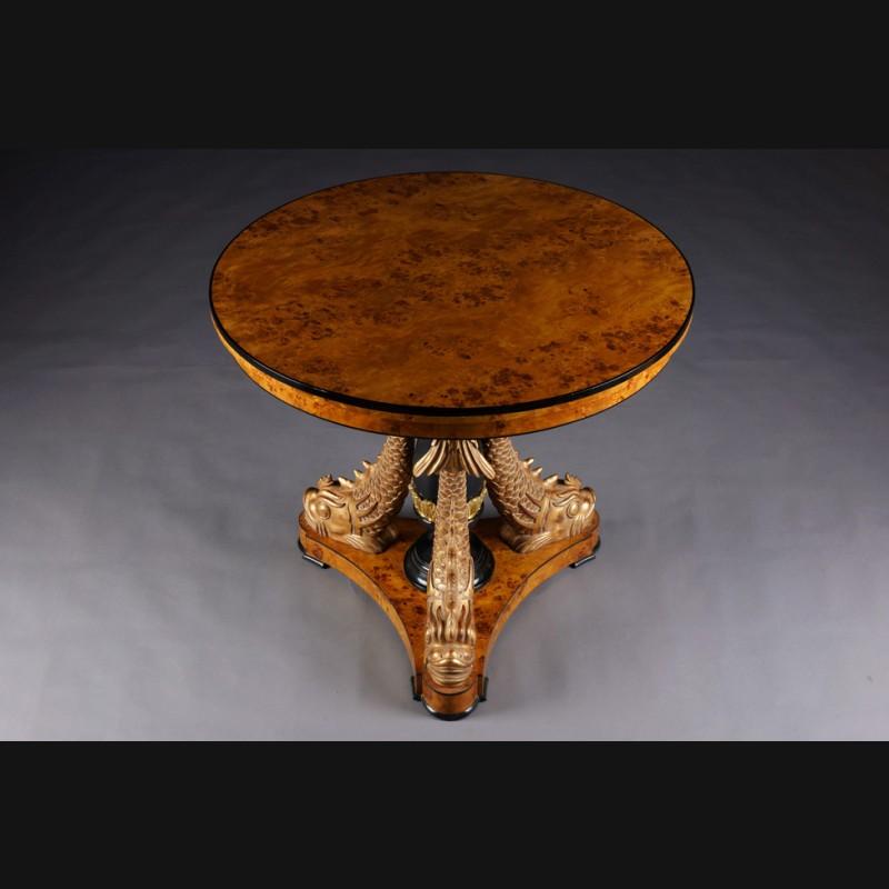 Highly significant and rare style table with dolphins in Empire style in 1815

Maple root on solid beech wood. A classicist table with three monumental, fully sculpted, hand carved dolphins in solid wood. Dandruff colored, heads and fins are made