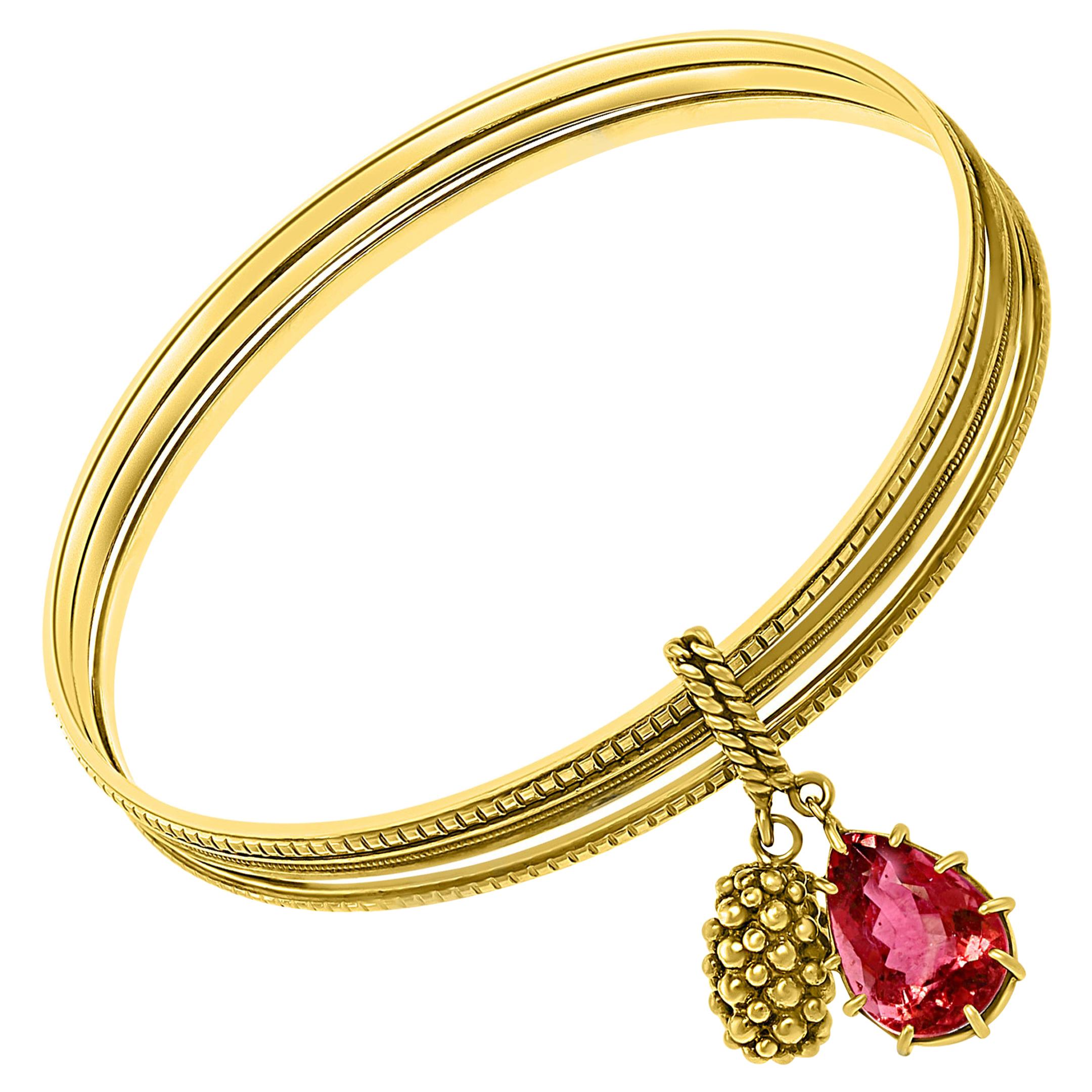 Magnificent Three Yellow Gold Bangle Attached by Pink Tourmaline and Gold Charm