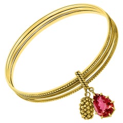 Magnificent Three Yellow Gold Bangle Attached by Pink Tourmaline and Gold Charm