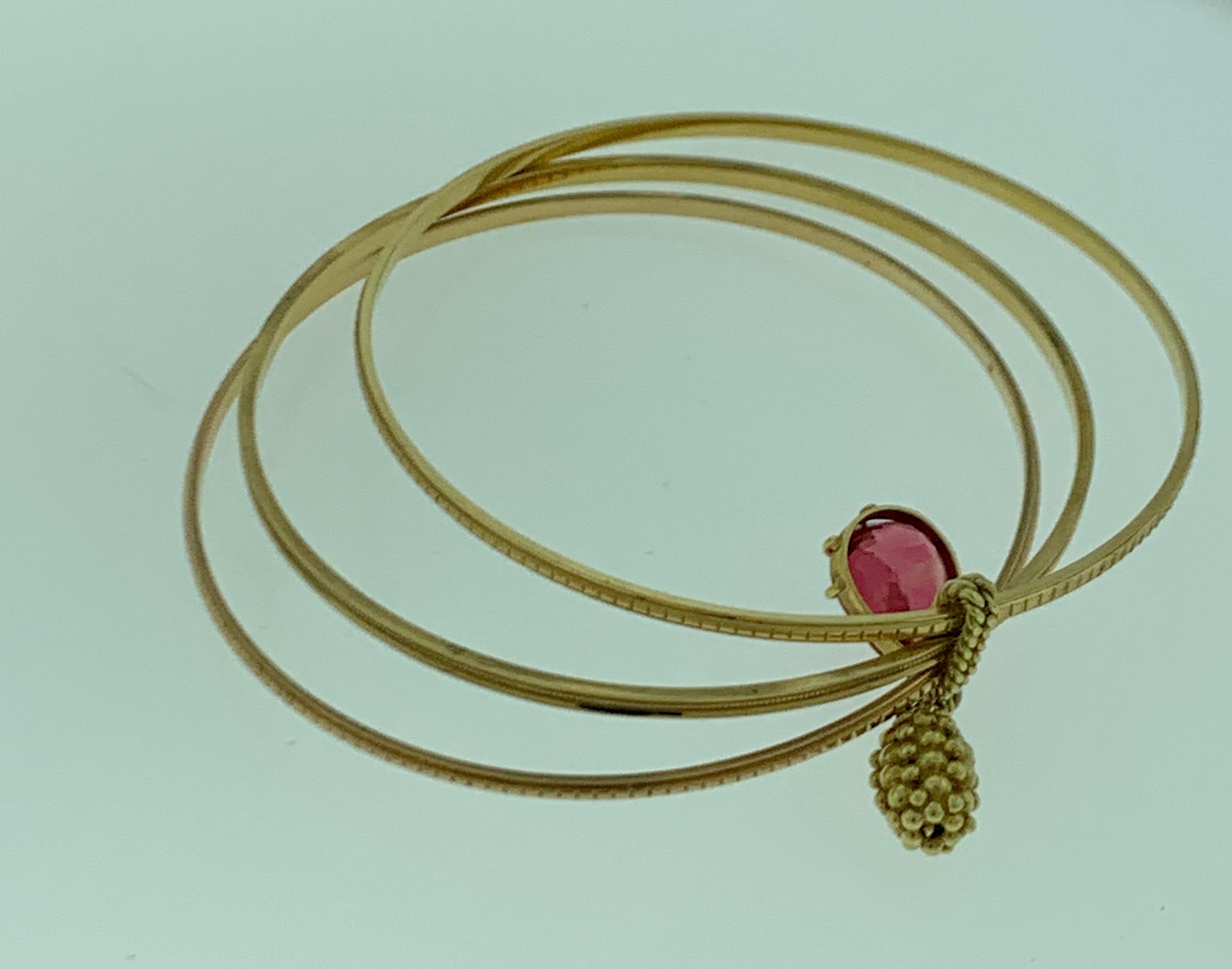 Magnificent Three Yellow Gold Bangle Attached by Pink Tourmaline and Gold Charm 1