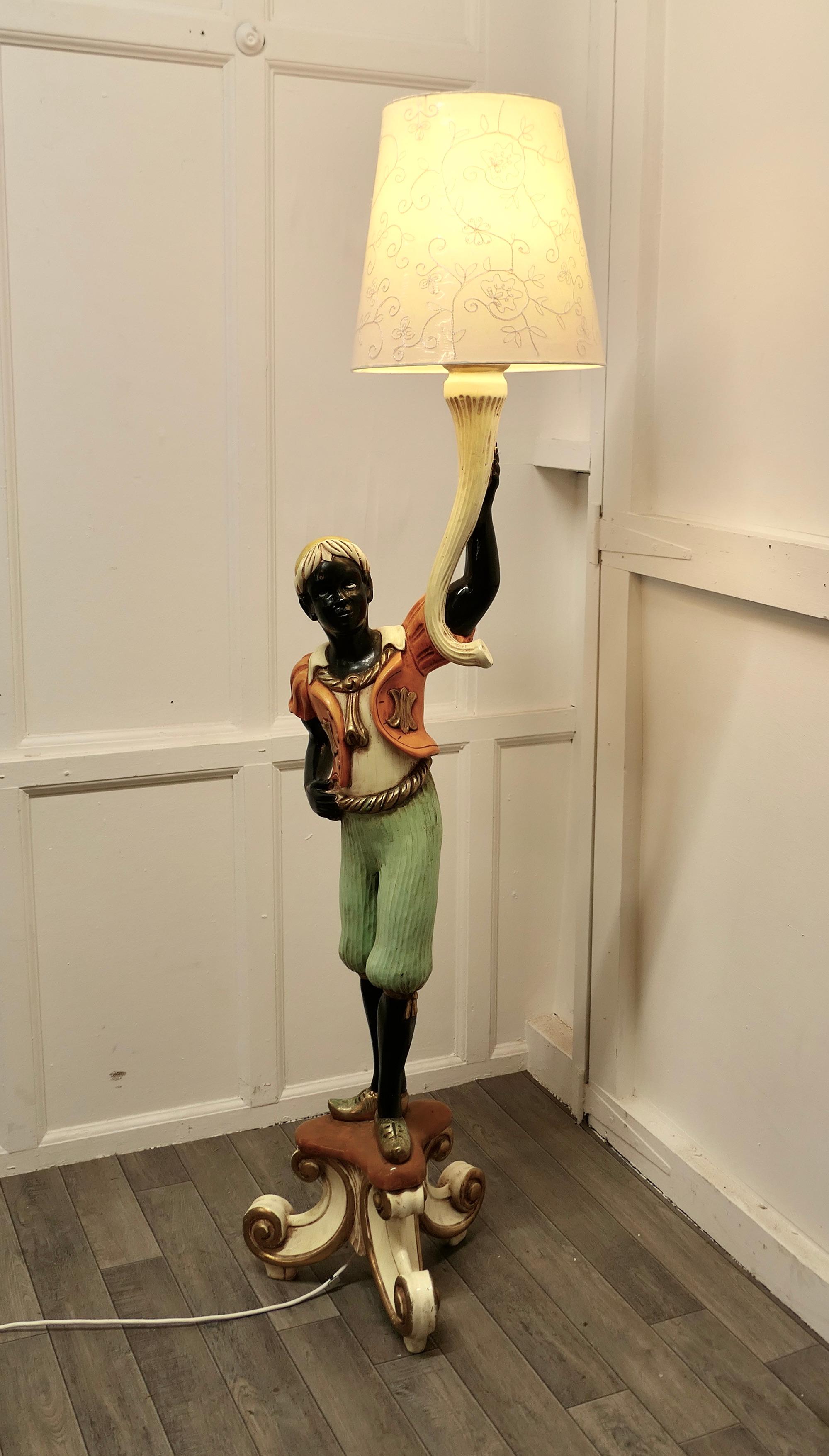 Magnificent Venetian figural floor lamp candelabra

 A Charming 5ft tall Italian carved wooden lamp
The Lamp is carved in soft wood which is painted over a gesso base coat, the colours are good and show very little wear and the boy is standing on