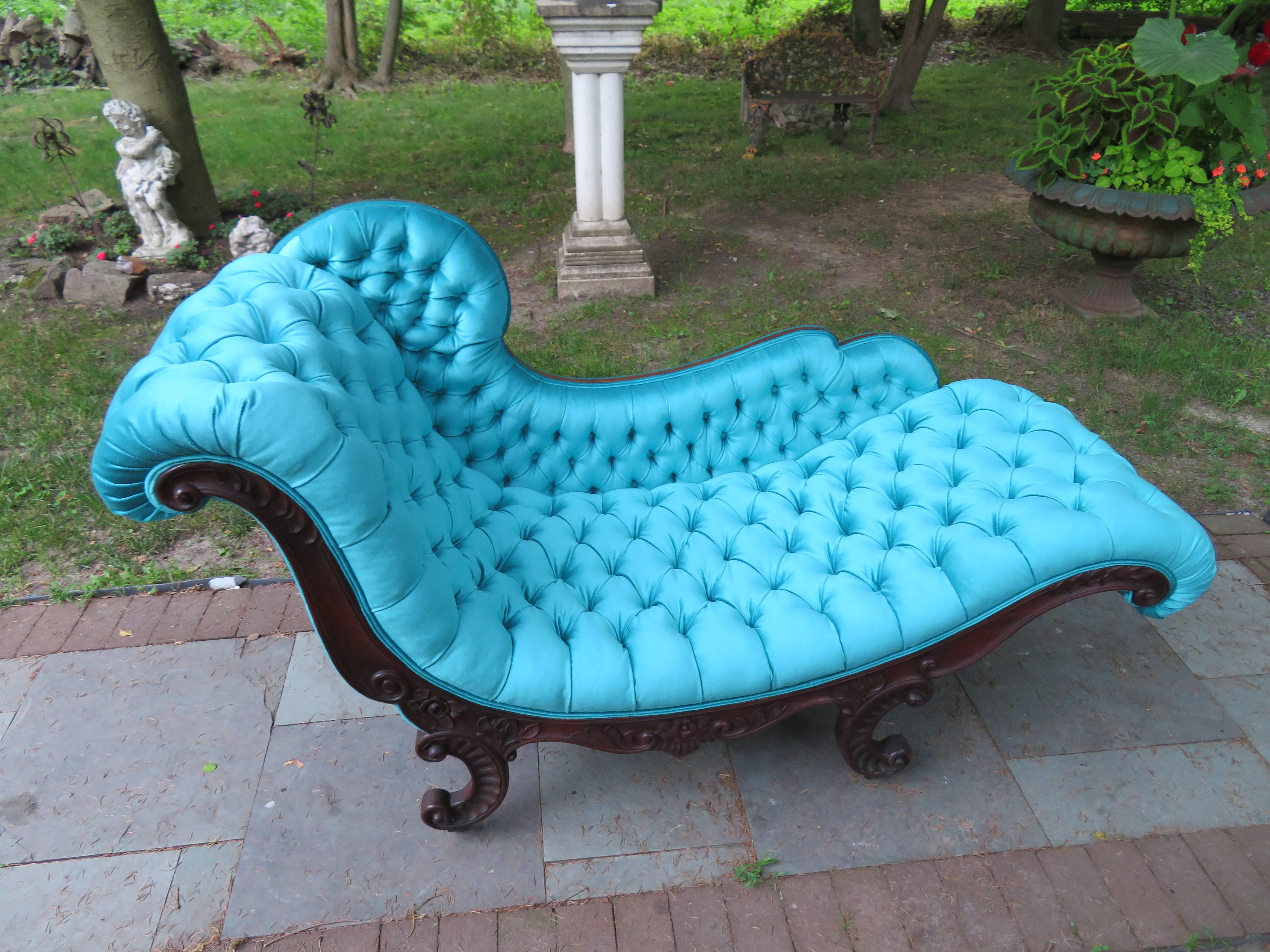 Magnificent Victorian John Henry Belter attributed rosewood tufted chase lounge. This piece has been reupholstered in a scrumptious high end peacock blue velvet and looks amazing. All of the foam and inner workings have been replaced making this