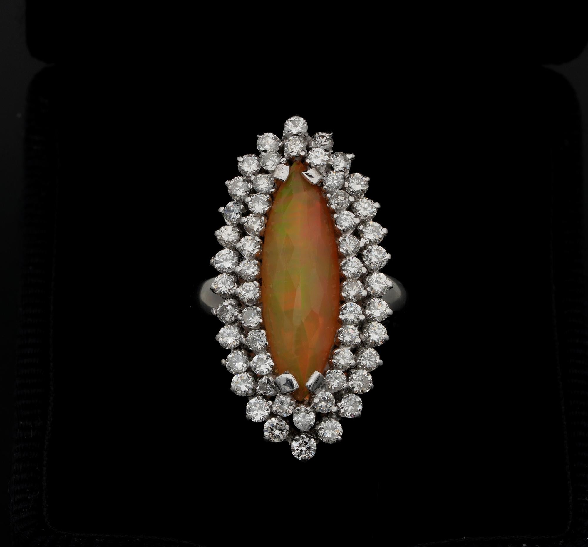 Be unique!

Magnificent mid century -1950 – Diamond and natural Opal cocktail ring
For sure a one off of the period, quite outstanding and eye-catching, attracting the attention from far way, for the amazing ballerina shape, grand Diamond sparkle