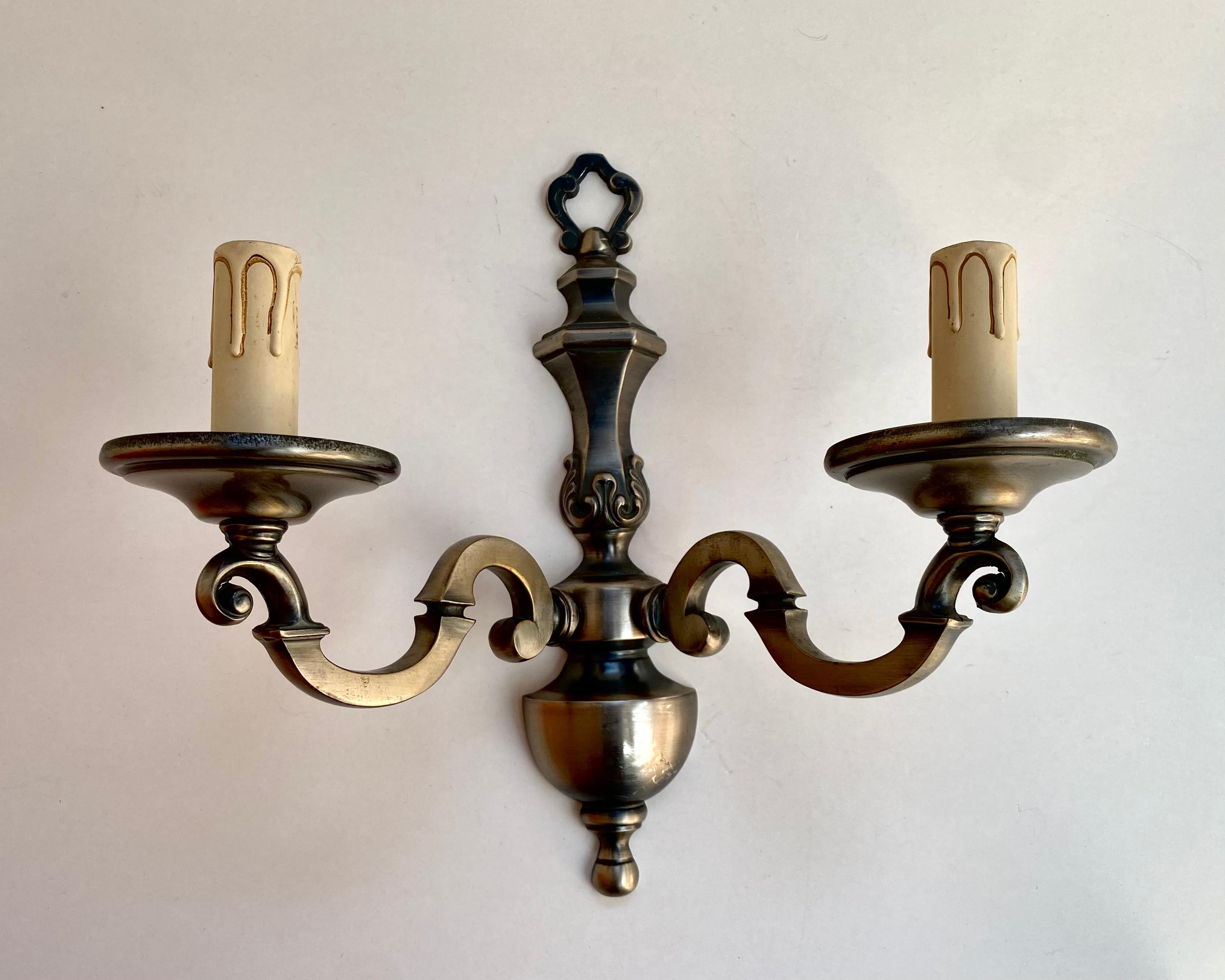Vintage Paired wall sconces in beautiful bronze from the French manufacturer. 1970s.

Set of Wall Lighting lamps in classic style with 2 horns on each.

Very noble and sensual! Such wall lamps will effectively complement the interior and become