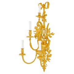 Magnificent wall lamp in Louis XVI style, 24 karat gold plated.