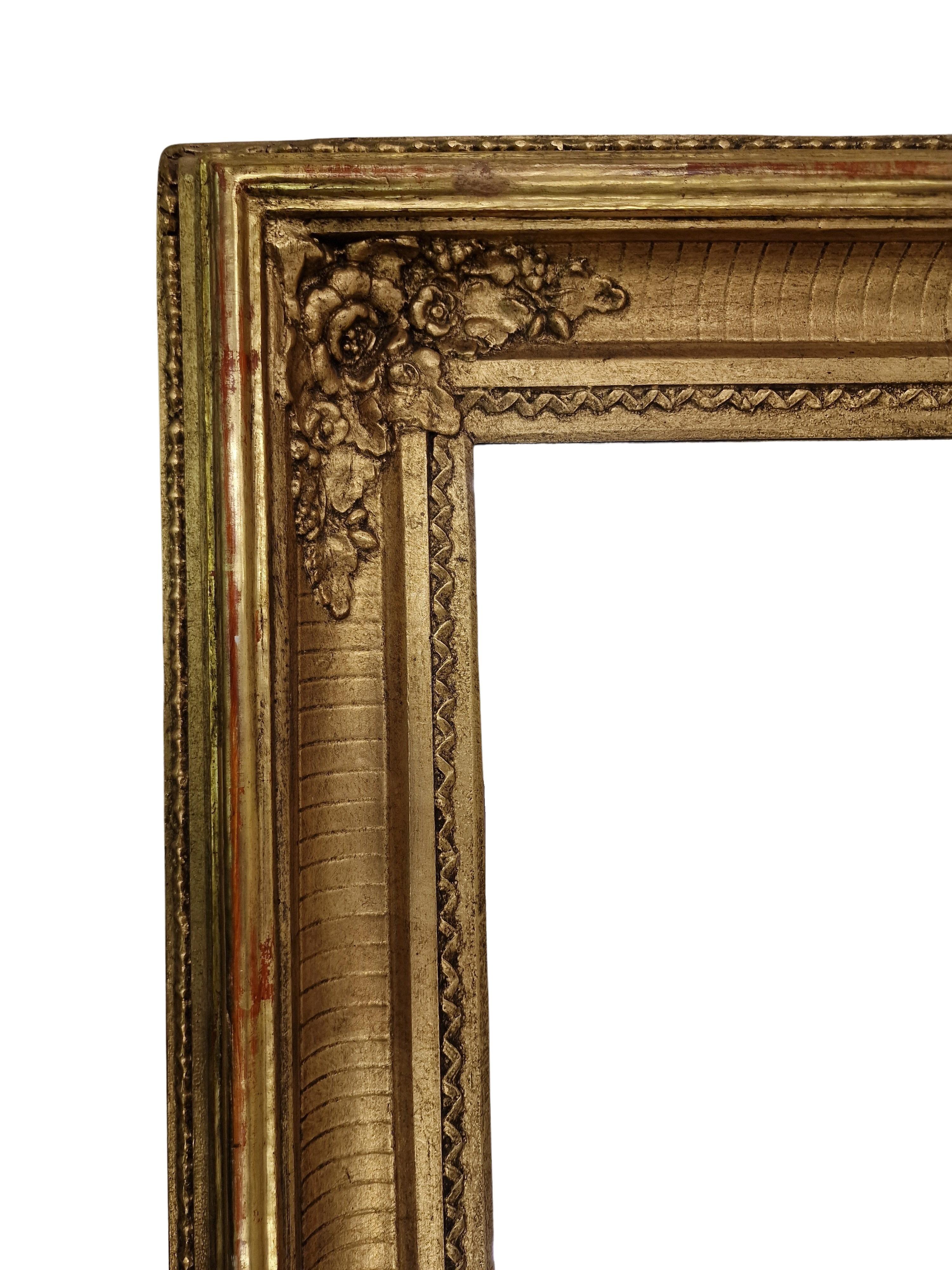 Magnificent wall mirror, frame, an impressive original from the 1880s, made in Austria. 

This impressive hand crafted object is made of wood with a stucco overlay, which is extremely splendidly crafted. There is a real gold surface above a red