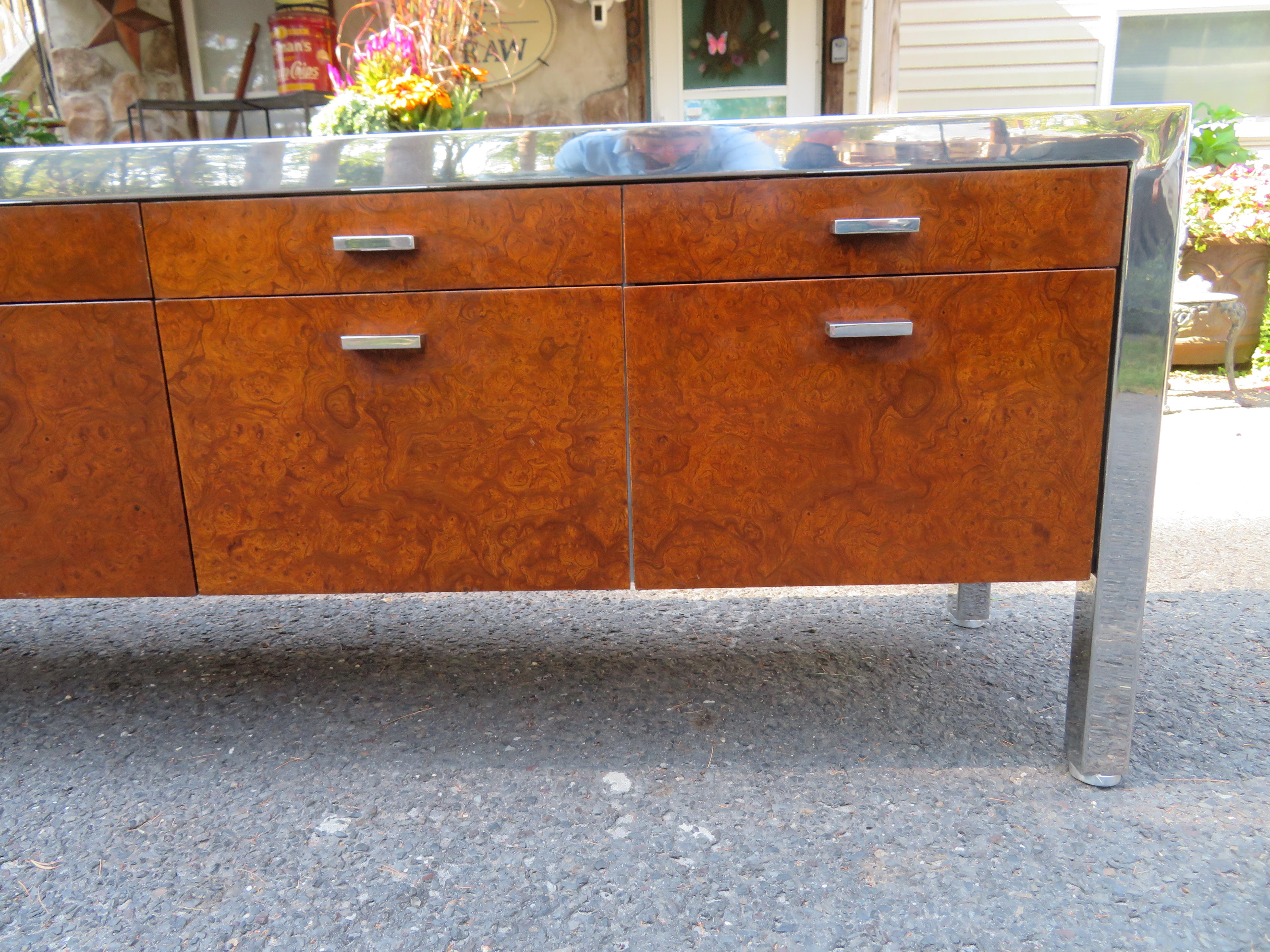Magnificent XL Mid-Century Modern burl wood and chrome credenza designed by Leon Rosen, manufactured by Pace Collection. In wonderful original condition, heavy and sturdy, this piece is even finished with burl wood veneer on the backside-perfect to