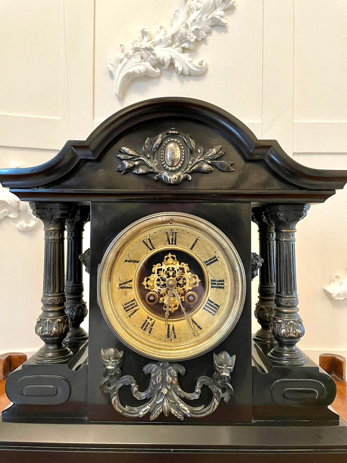 Magnificent French marble eight-day mantel clock having an exquisite brass bezel ornate brass face with original hands, eight-day movement striking on the hour and half hour, shaped top with pretty ornate brass mounts supported by four impressive