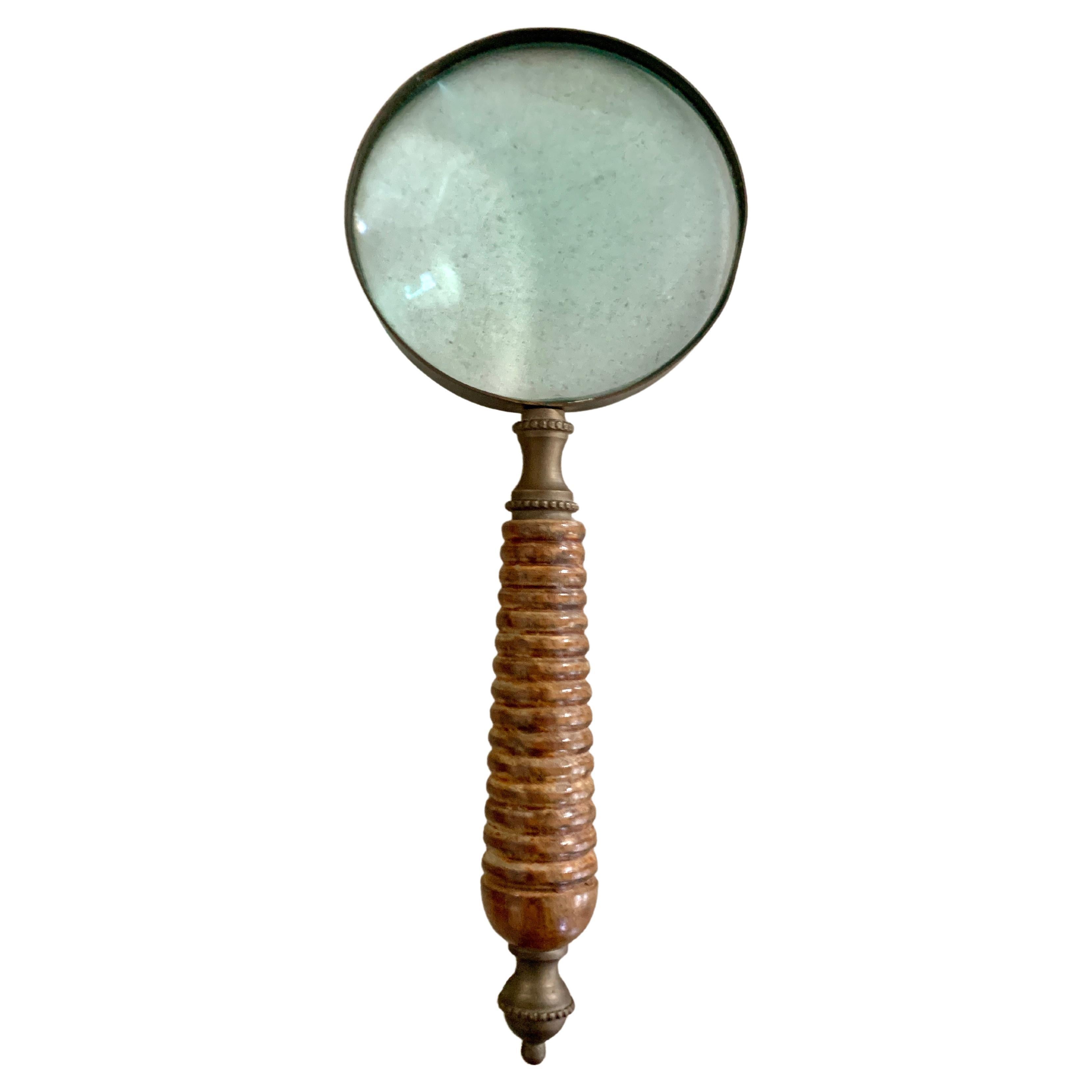 Magnifying glass with carved wooden handle and brass finial - a compliment to any desk or work station... the Ralph Lauren #cottagestyle Look. For those who need a bit of assistance reading a recipe, back of a box, or just want to add a look of