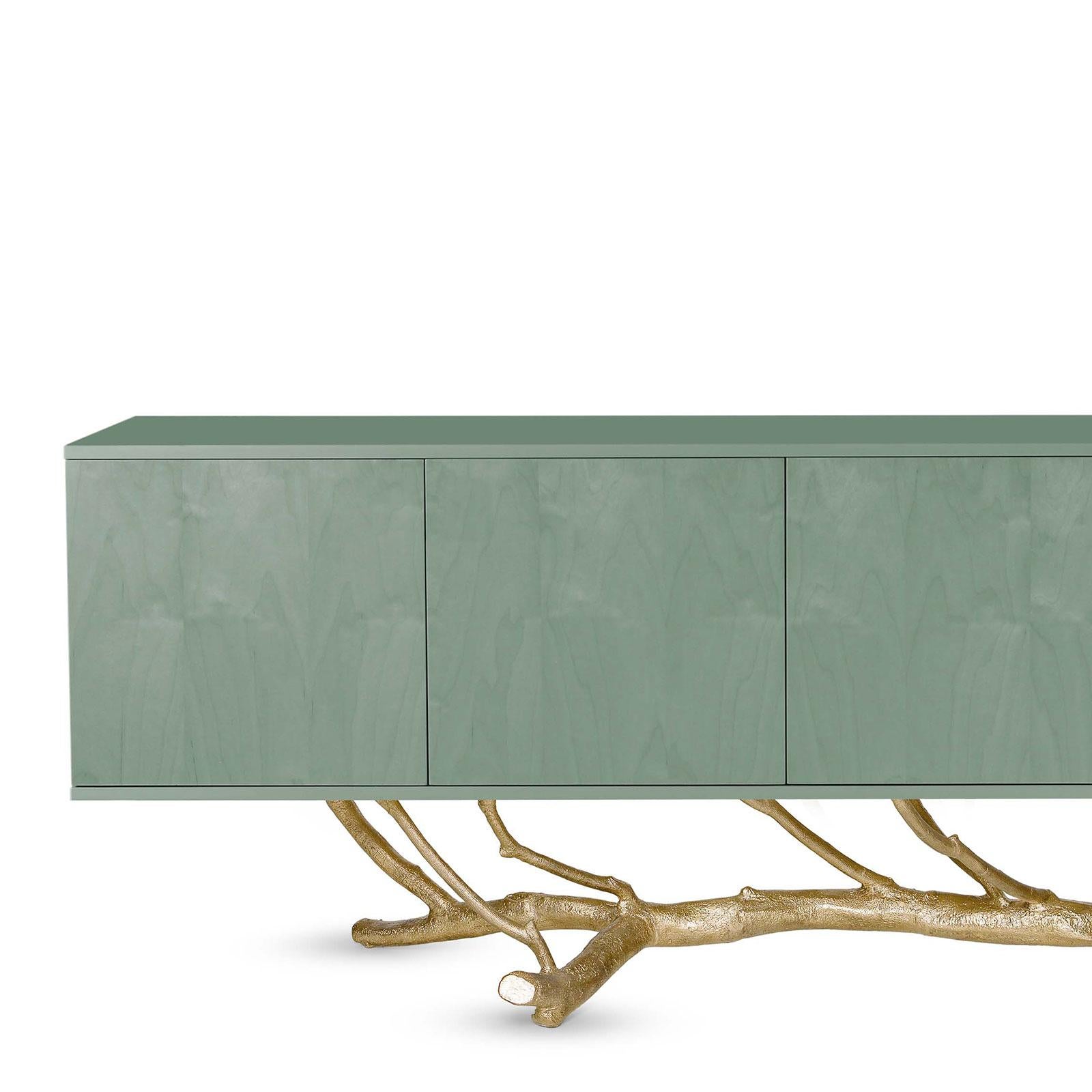 Magnolia Sideboard by Ginger & Jagger
Dimensions: D 60 x W 200 x H 91 cm. 
Materials: Miosotis wood veneer, lacquer, and brass.
Finish: Doors in Miosotis wood veneer in gloss; body in lacquer in gloss; drawers and shelves in lacquer in gloss; base
