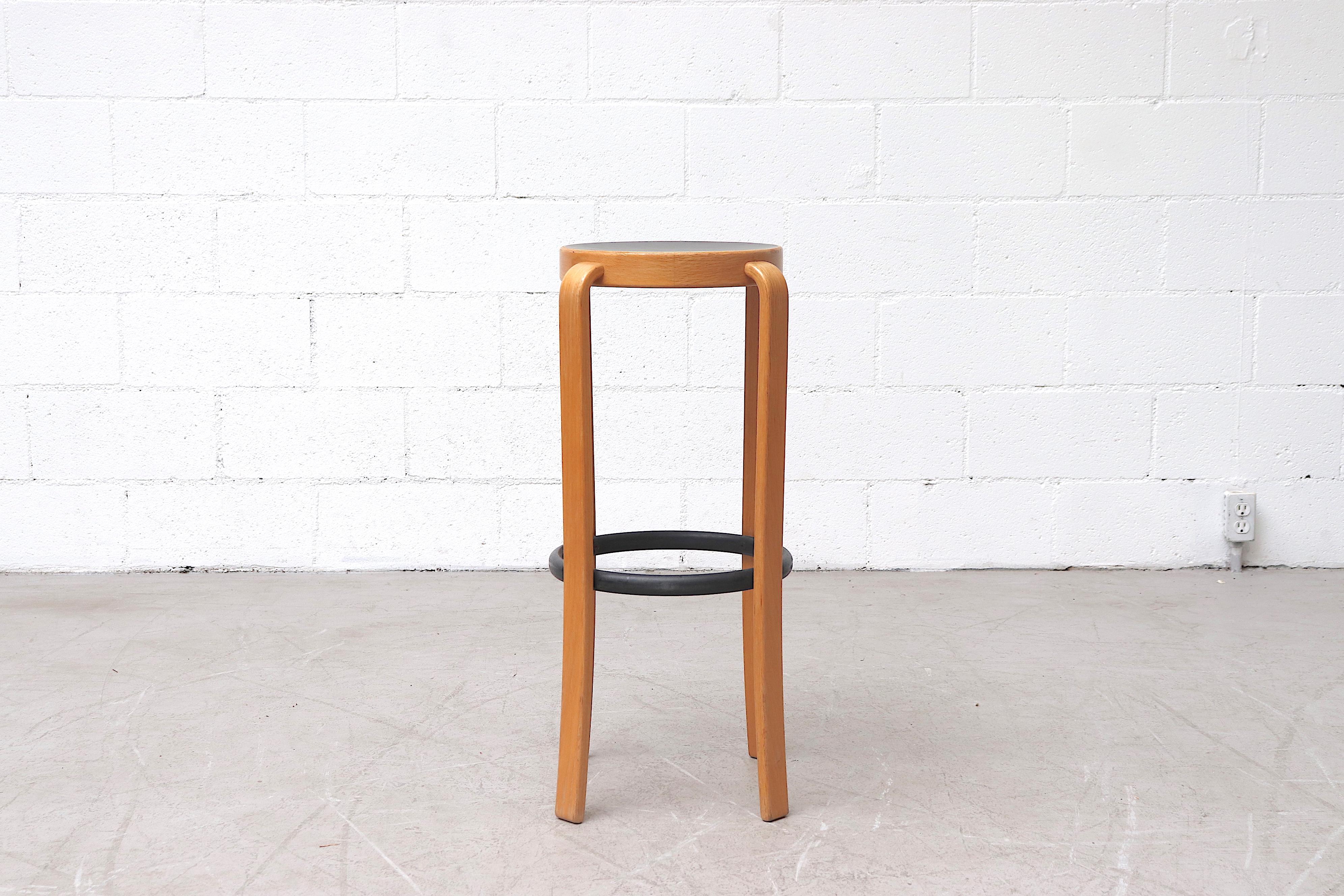 Magnus Olesen birch bar stools with bent wood legs, black seats and 14