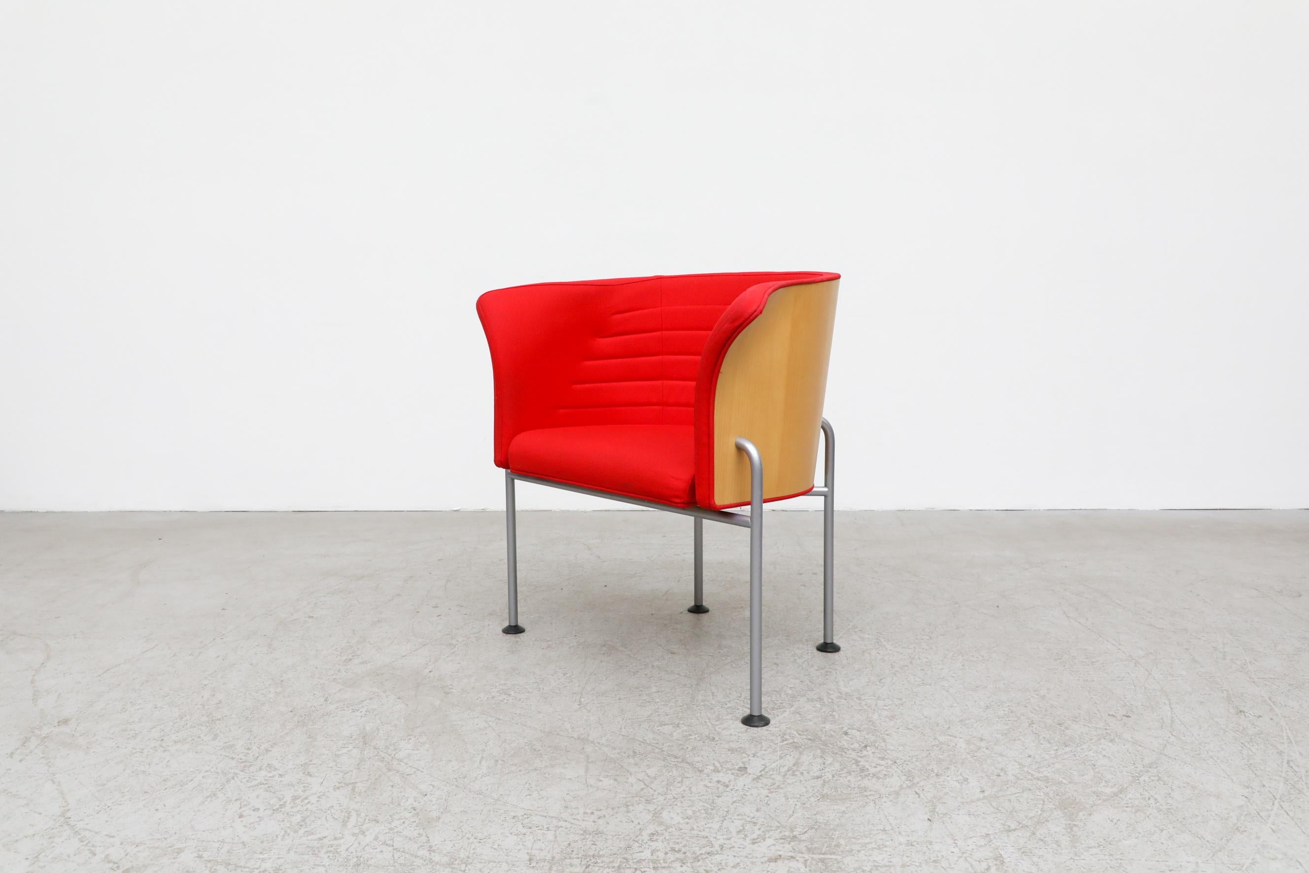 1990's Modernist Magnus Olesen Lotus Chair by Rud Thygensen & Jonny Sørensen. Red upholstered seating with a vacuum molded white ash wood body, upholstered seating and metal legs. In original condition with wear consistent with its age and use.