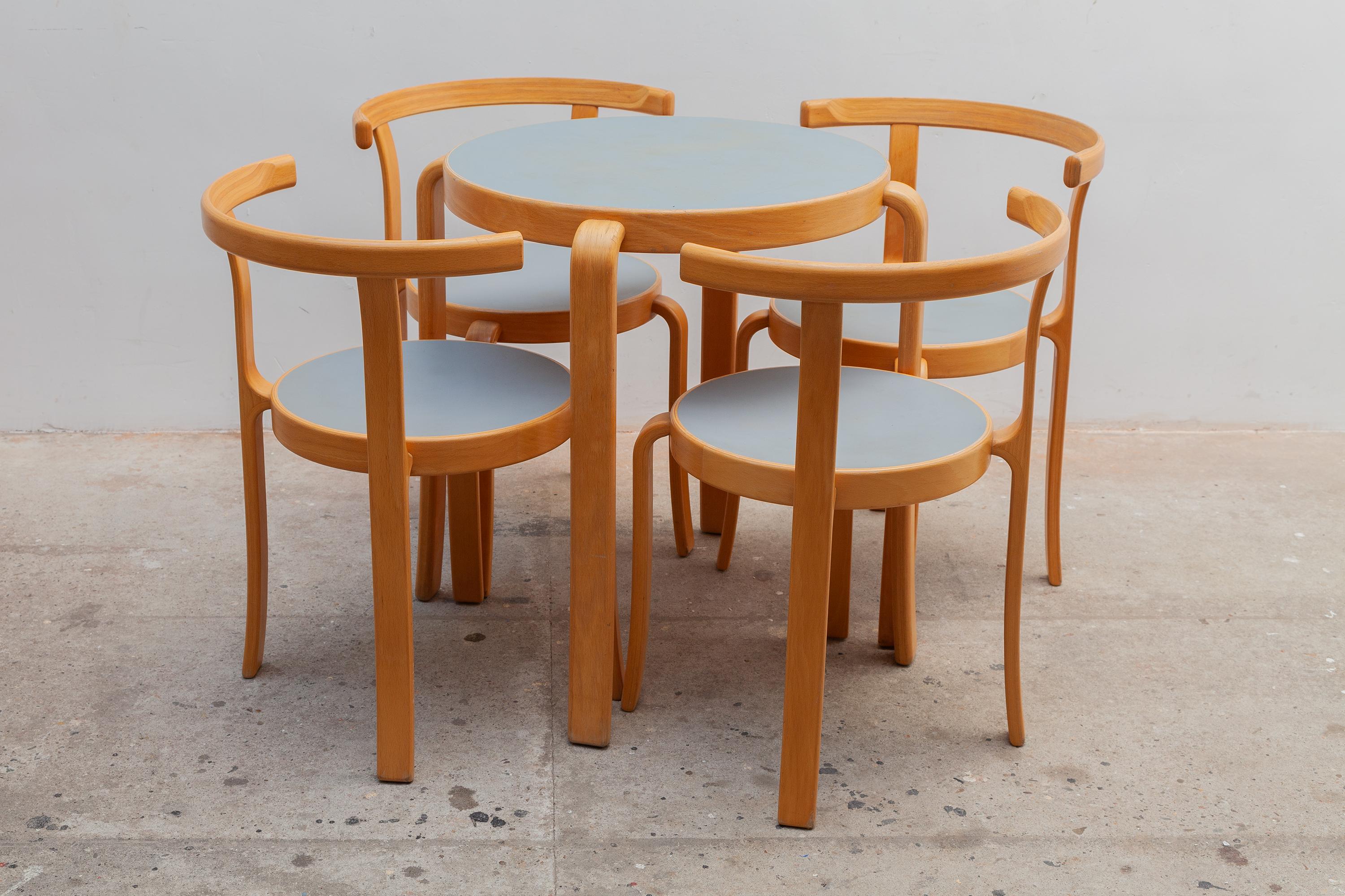 Vintage set of four Danish dining room chairs and table designed by Rud Thygsen & Johnny Sorensen for Magnus Olesen in 1981. These chairs are from the 8000 series the round shapes are characteristic of these designers. These chairs are made with a