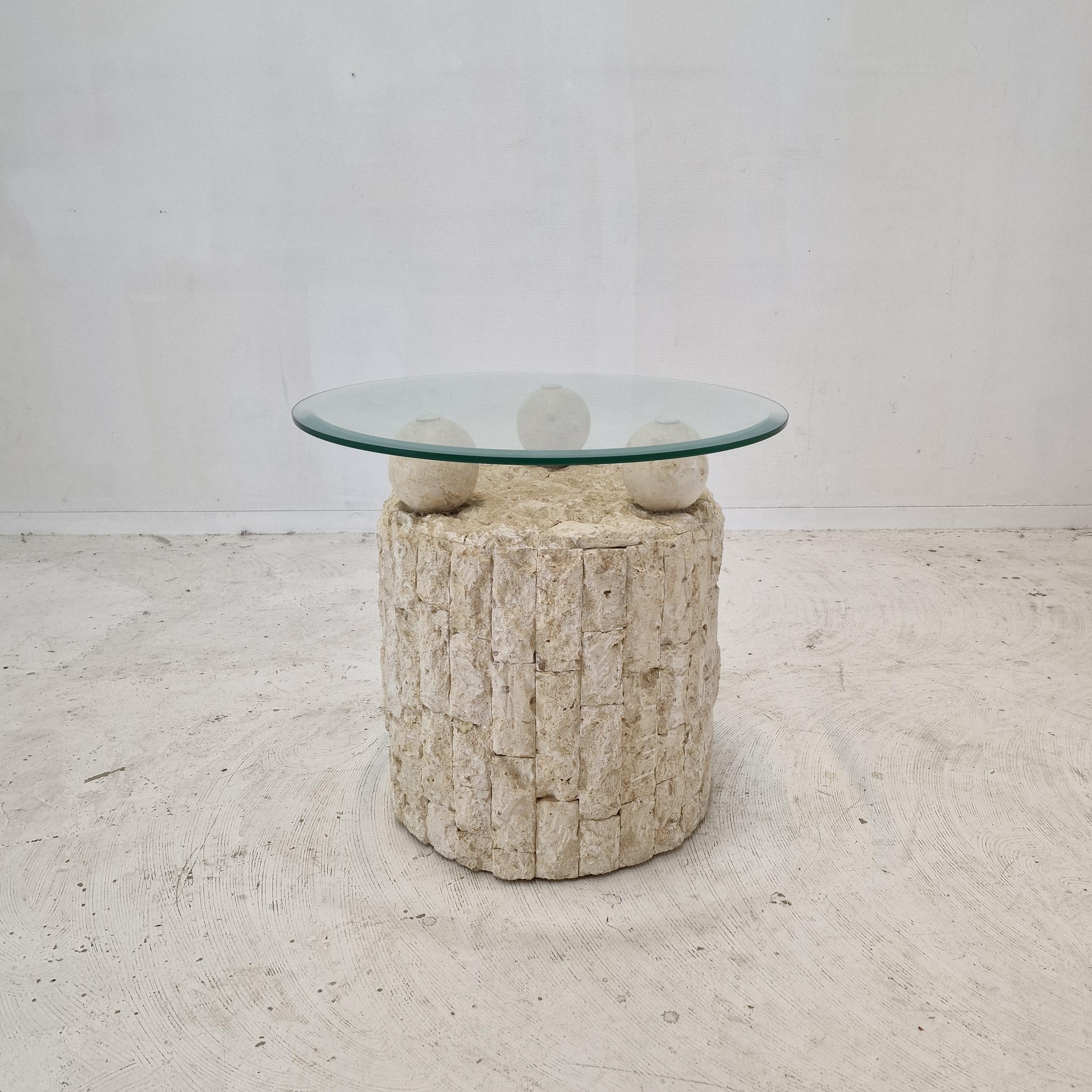 Lovely Postmodern 1980s design, coffee or side table by Magnussen Ponte.

The base of this cute table is made of rough edged brick motif Mactan stone or Fossil Stone. 

Three stone balls holding the removable circular facet cut glass plate.
The