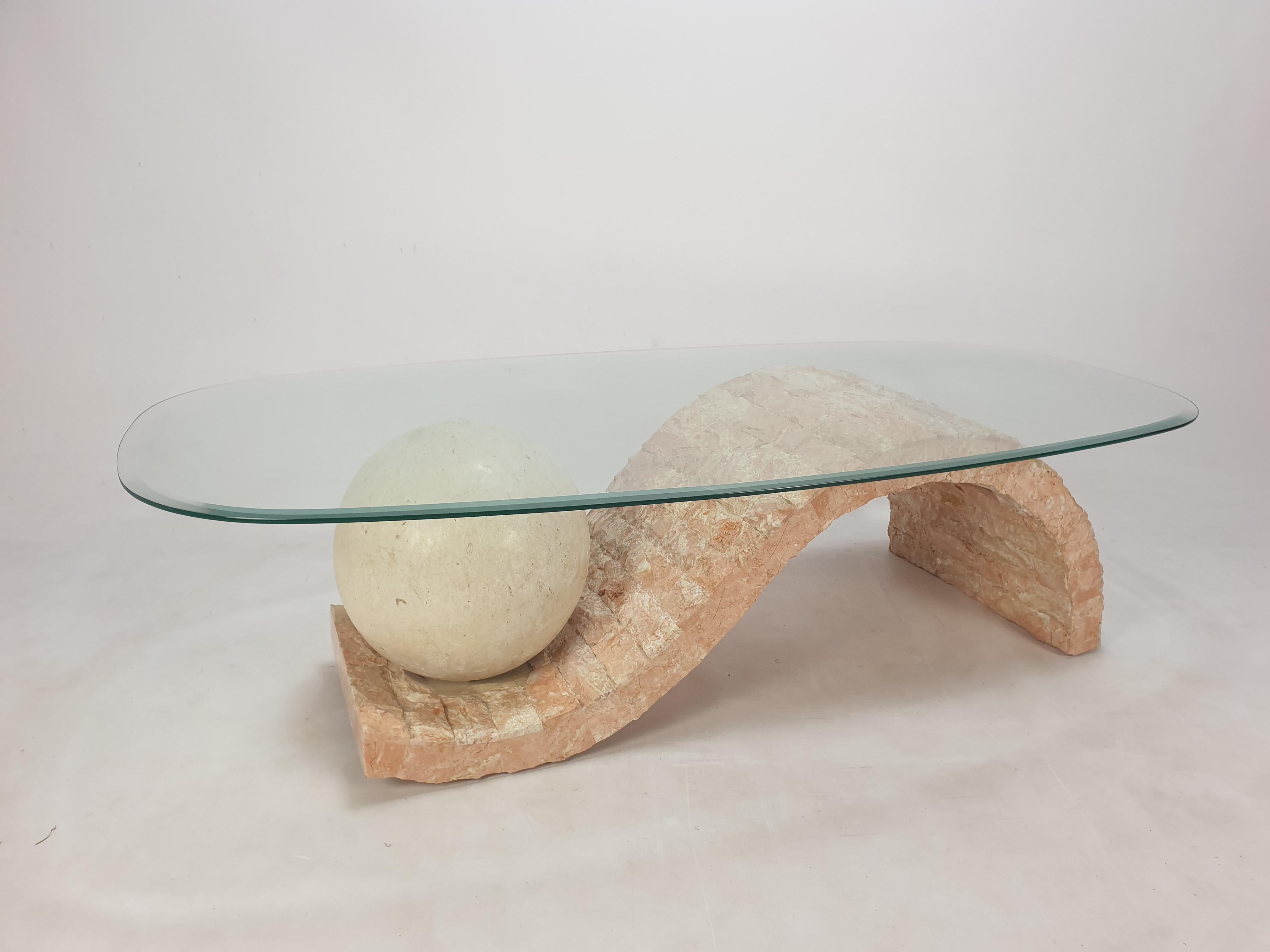 Rare and very nice coffee or side table by Magnussen Ponte, 1980's.

The stunning table base is made of Mactan stone or Fossil Stone.

It has a facetted glass plate.

We work with professional packers and shippers, we ship worldwide.