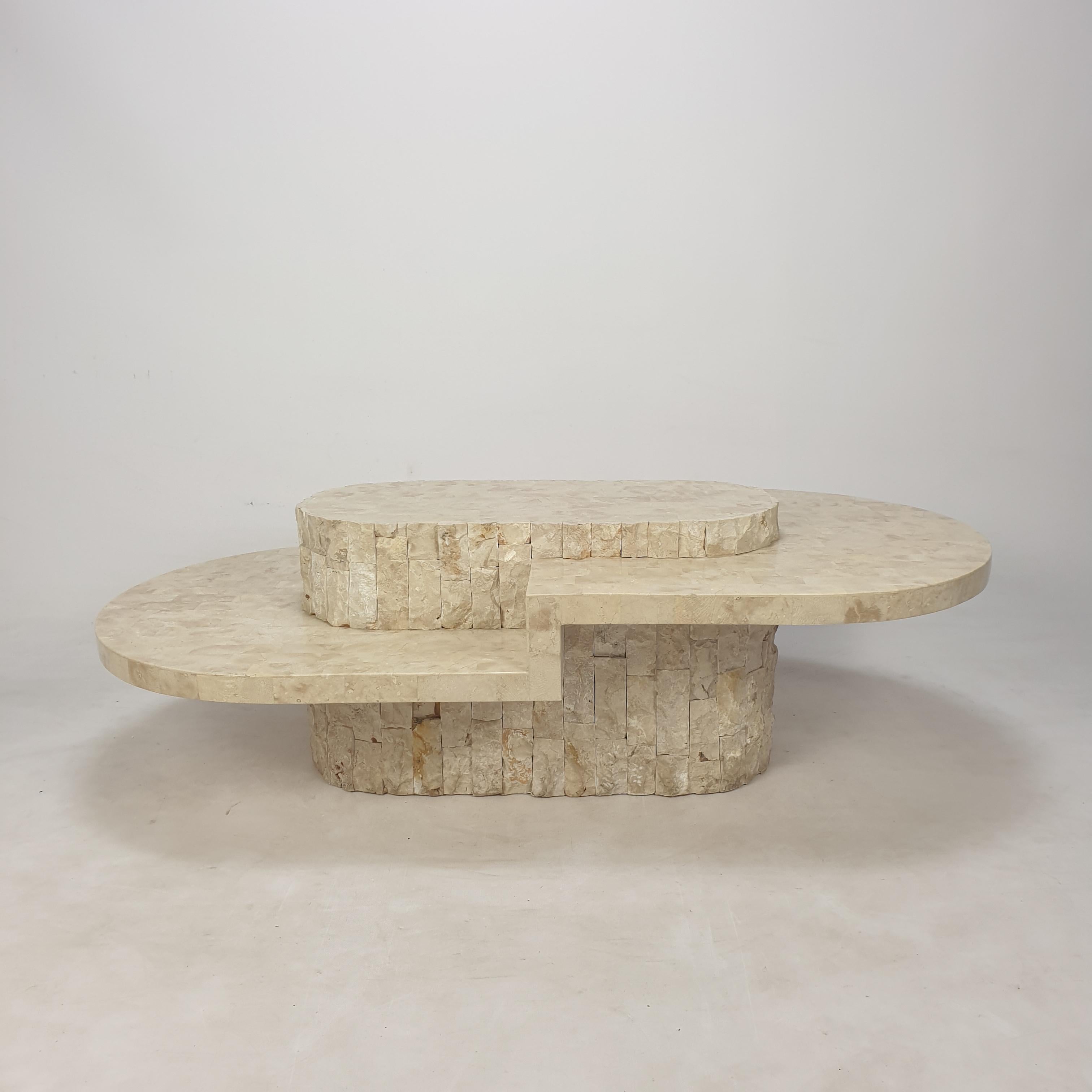 Rare and very nice coffee or side table by Magnussen Ponte, 1980's.

This stunning table is made of rough edged brick motif Mactan stone or Fossil Stone.

We work with professional packers and shippers, we ship worldwide. 
 