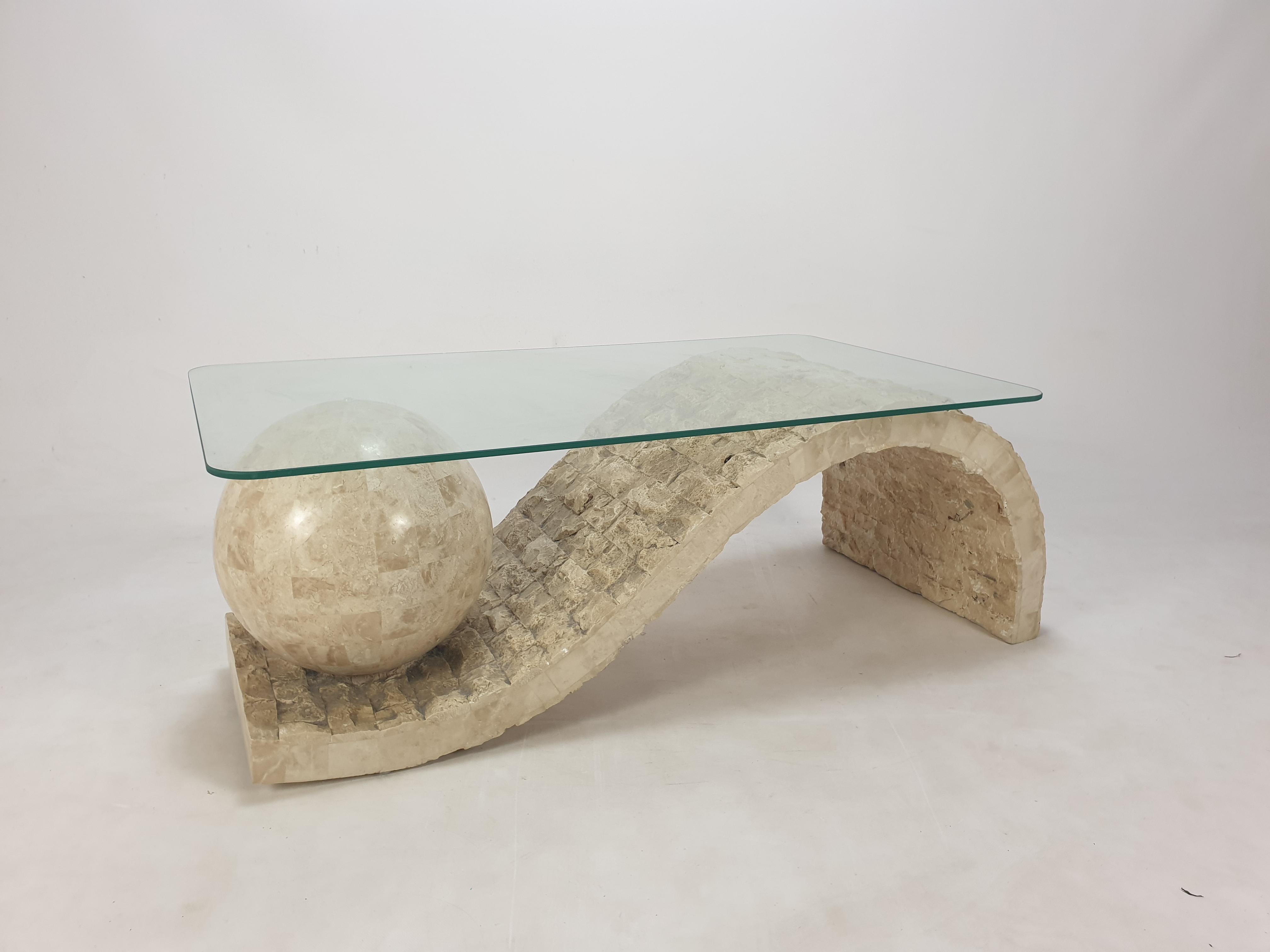 Very nice coffee or side table by Magnussen Ponte, 1980's.

The stunning table base is made of Mactan stone or Fossil Stone.
 