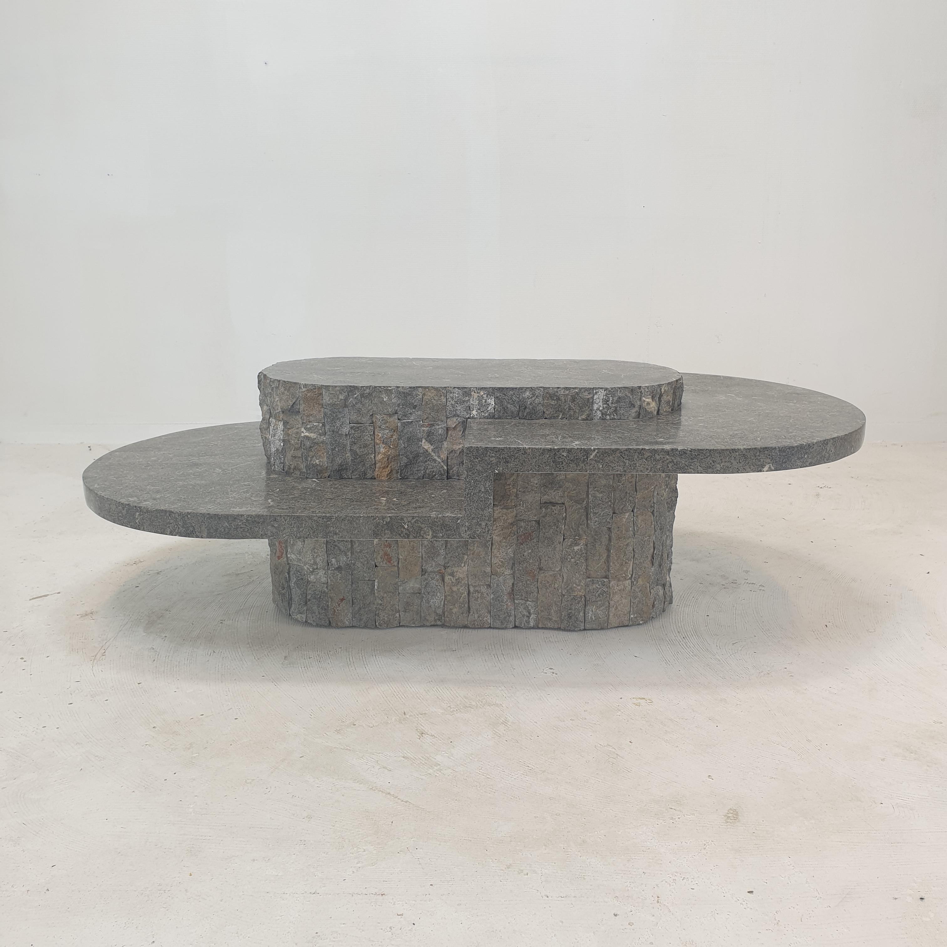 Rare and very nice oval coffee or side table by Magnussen Ponte, 1980's.

This stunning table is made of rough edged brick motif Mactan stone or Fossil Stone.

This is a unique piece!

We work with professional packers and shippers, we can