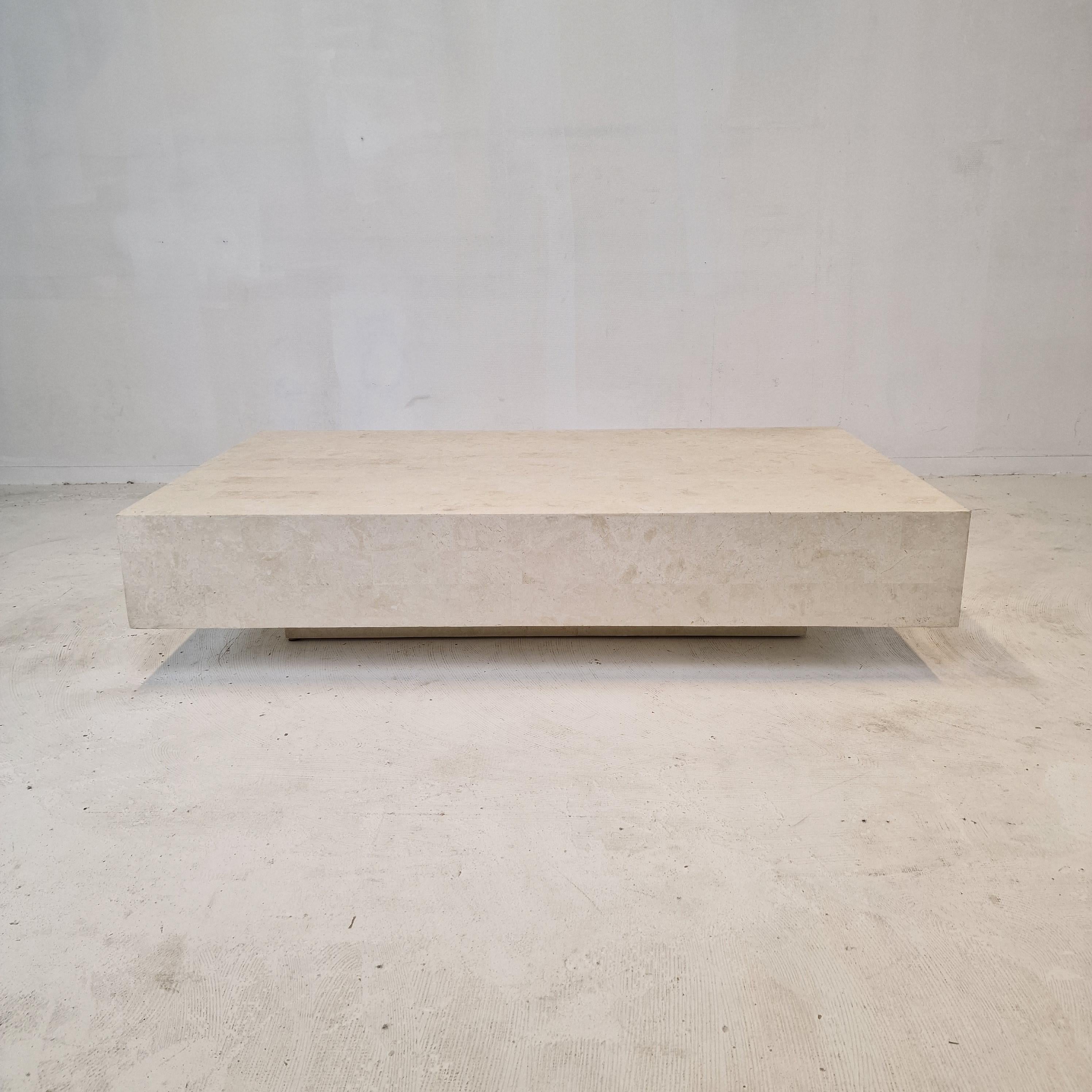 Rare and very nice coffee table by Magnussen Ponte, 1980s.

This stunning table is made of Mactan stone also named Fossil Stone.

Mactan stone is found only on the island of Mactan in the South Philippines. 
It is an ancient rock in which you